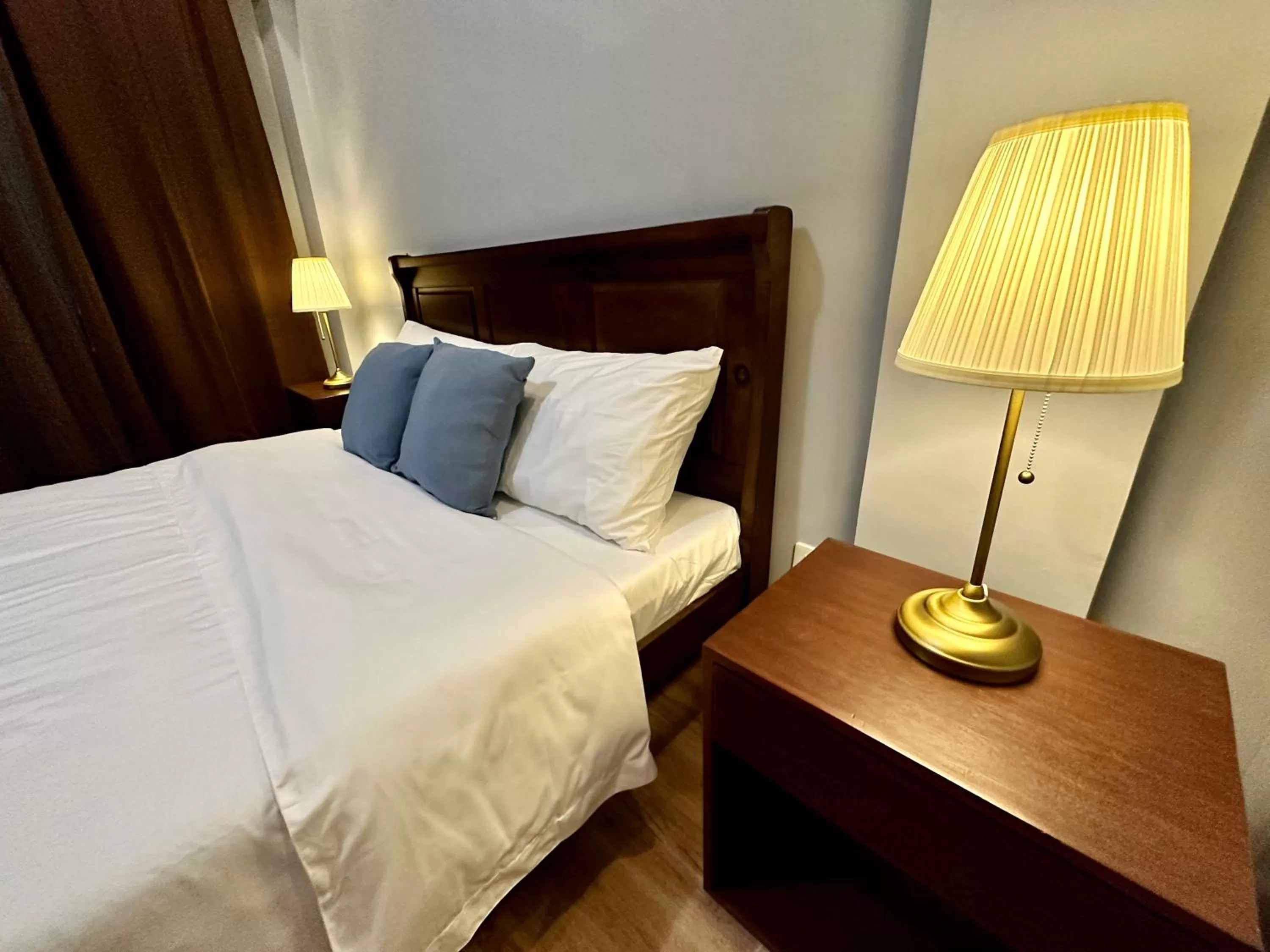 Bed in Harbour Bliss Hotel