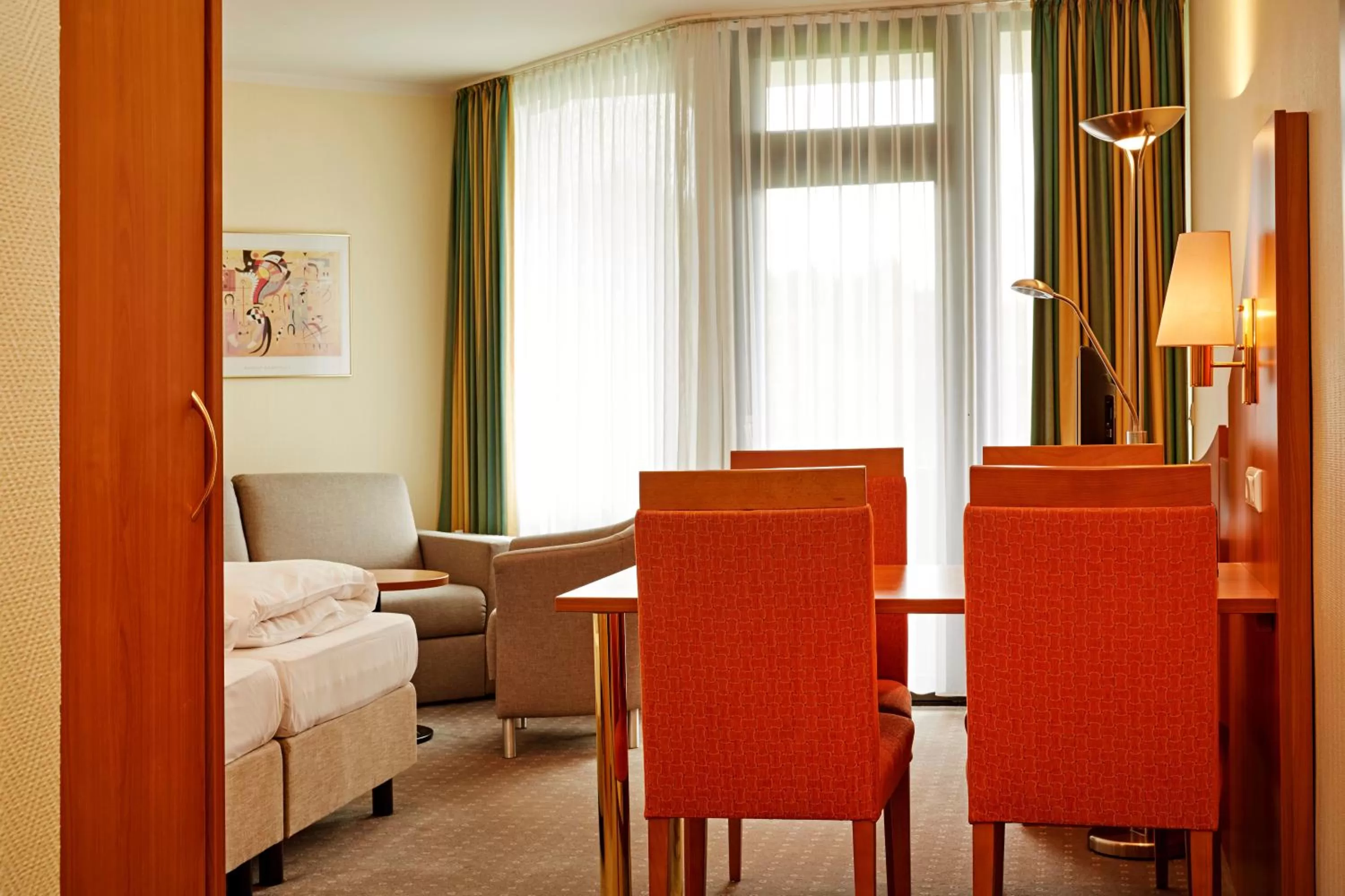 Seating area, Bed in H+ Hotel Willingen