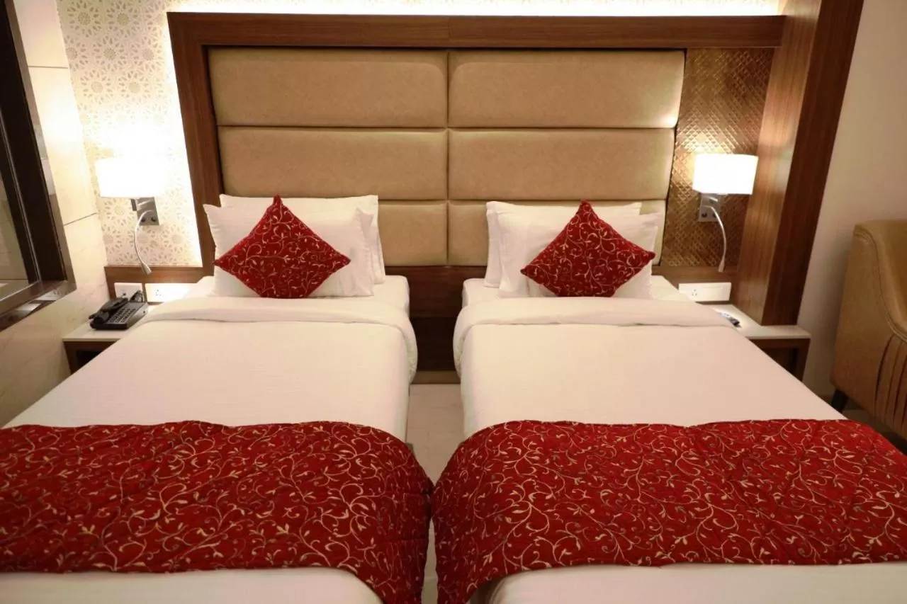 Bed in Hotel Gurudev Grand
