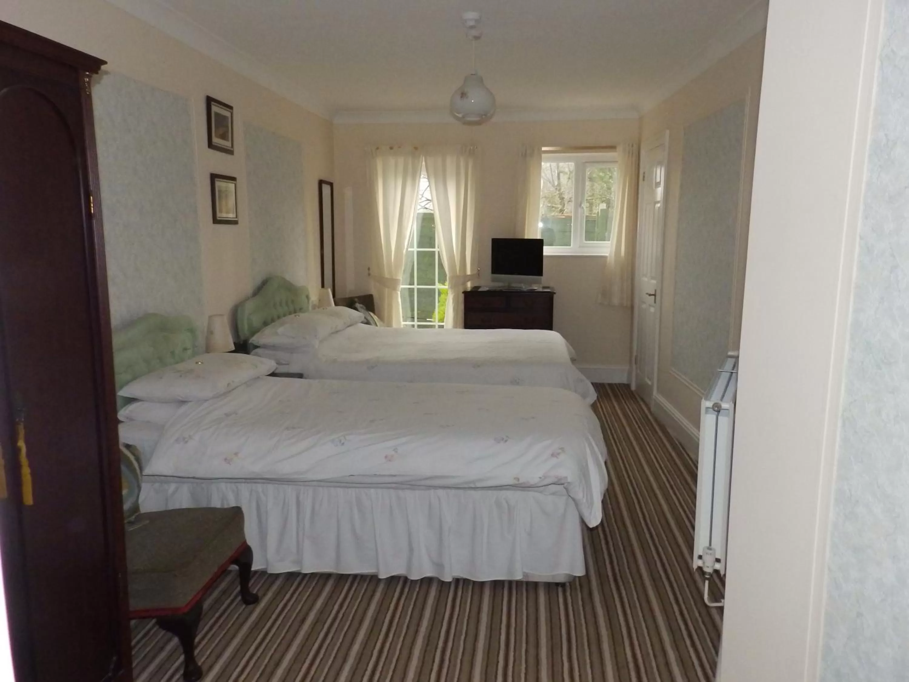 Bed in Rosedene Guest House