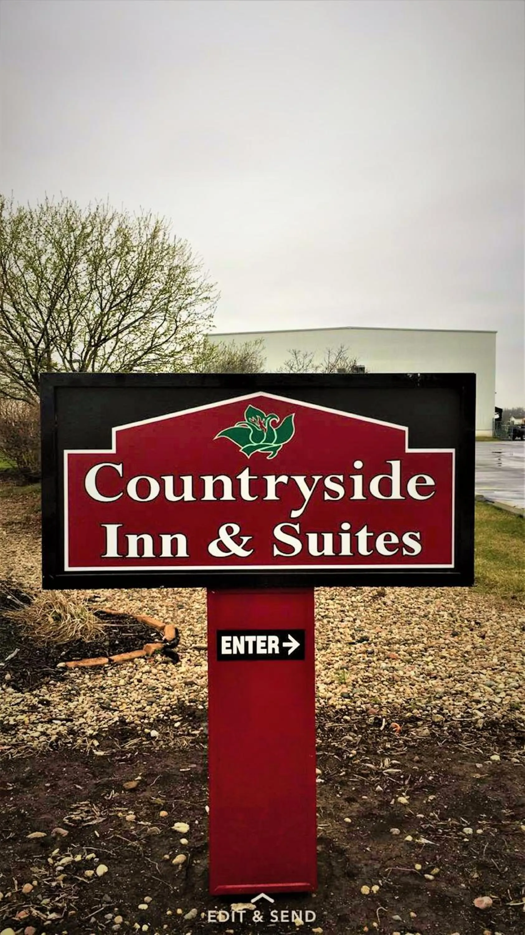 Property logo or sign in Countryside Inn & Suites Omaha East-Council Bluffs IA