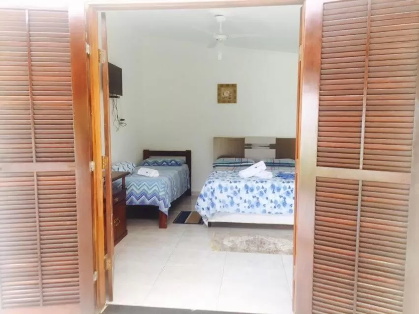 Bed in Pousada Recanto do Teimoso