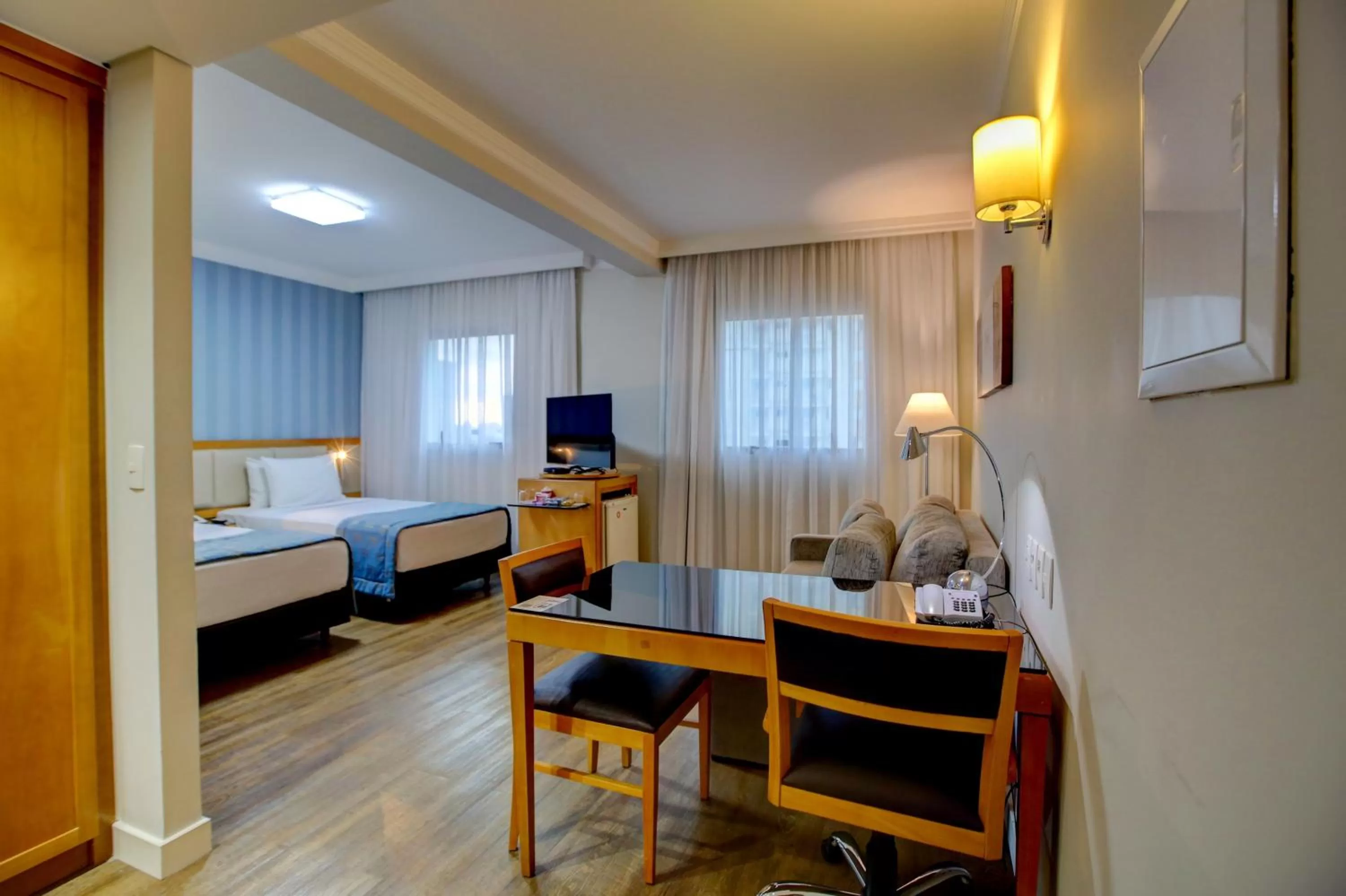 Dining area, Bed in Quality Suítes Oscar Freire