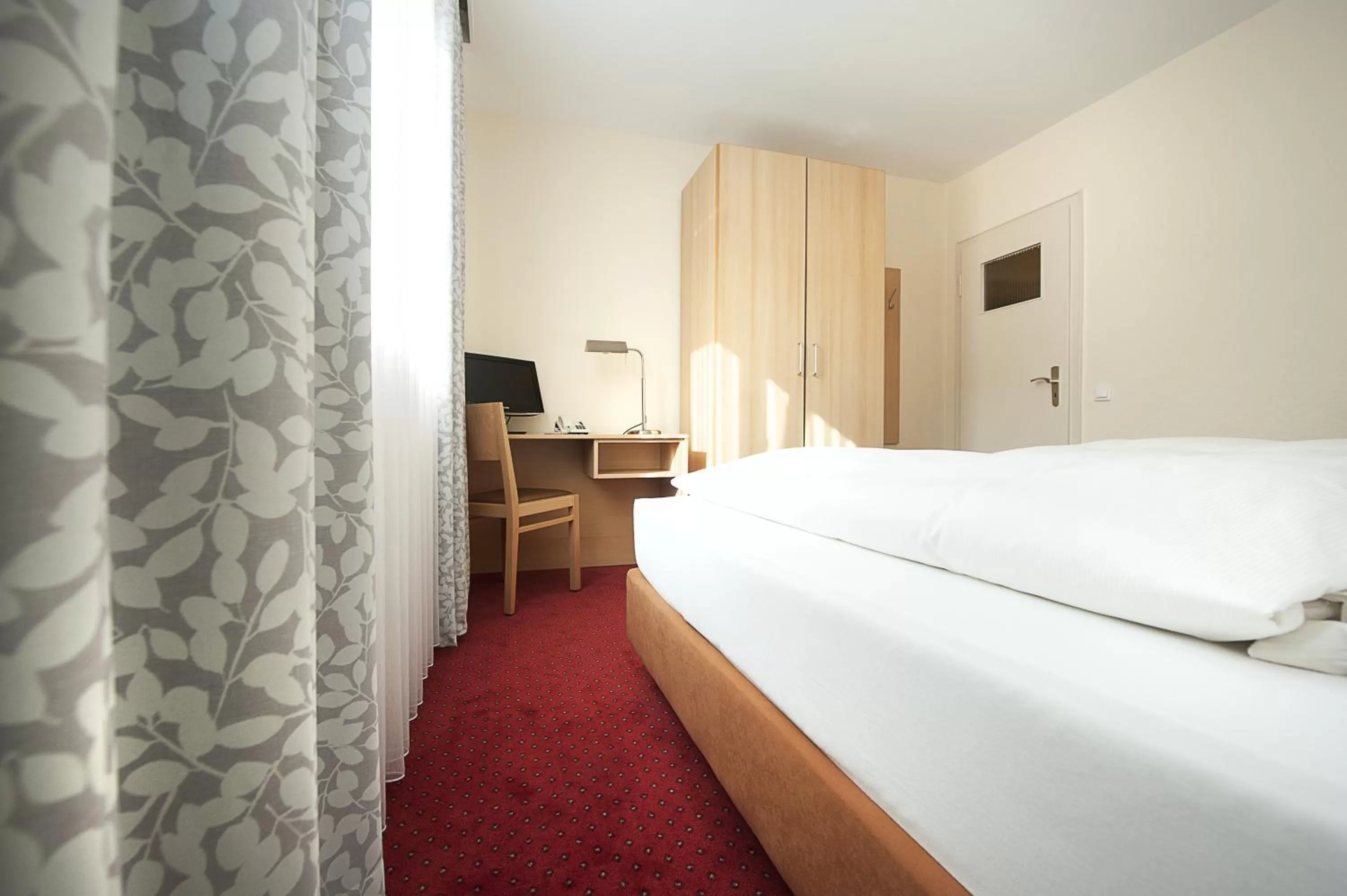 Photo of the whole room, Bed in Comfort Garni Stadtzentrum Hotel