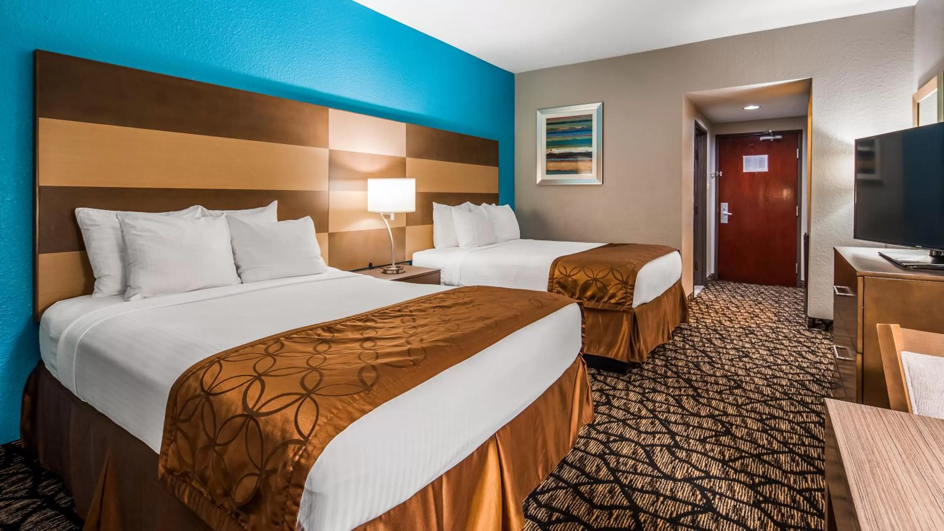 Queen Room with Two Queen Beds and Mobility Accessible Bathtub in Best Western Executive Inn