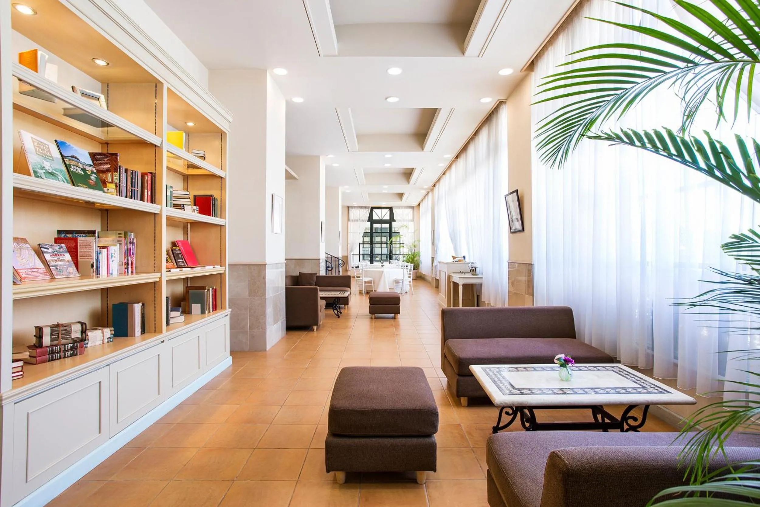 Communal lounge/ TV room in Luke Plaza Hotel