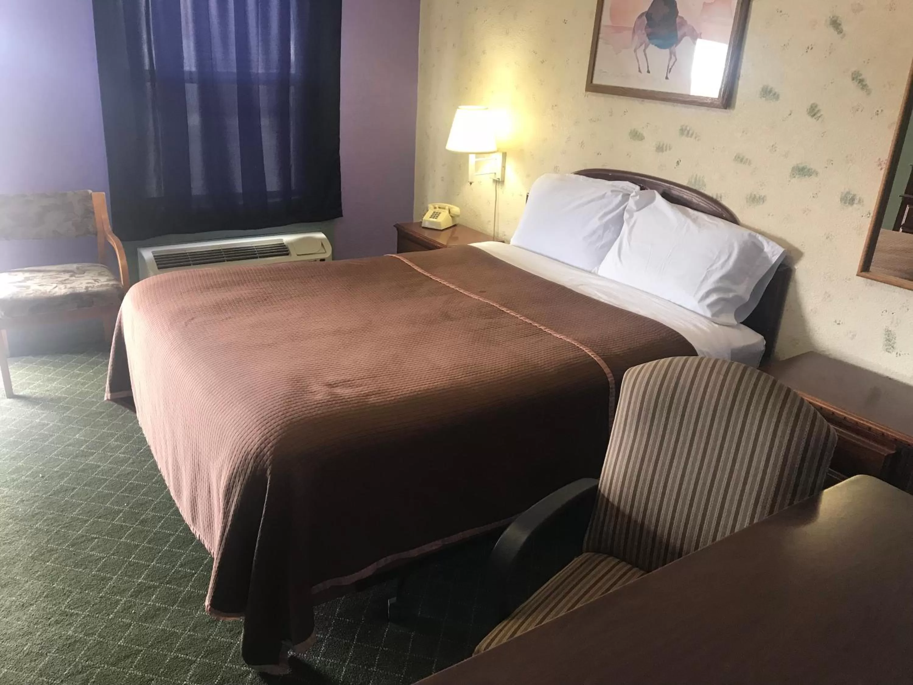 Bed in Western Inn Roswell