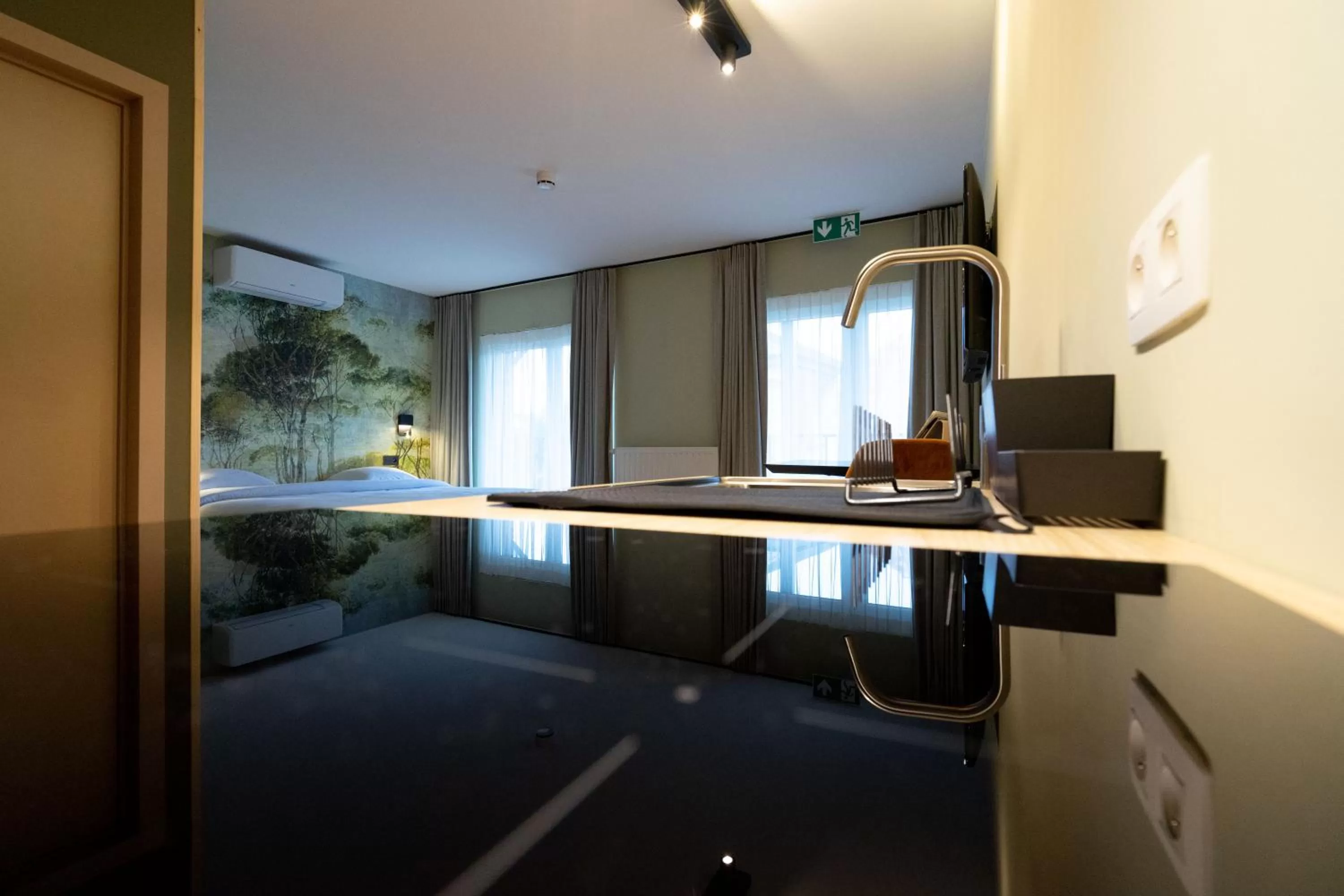 Kitchen or kitchenette in Appart hôtel En Ville