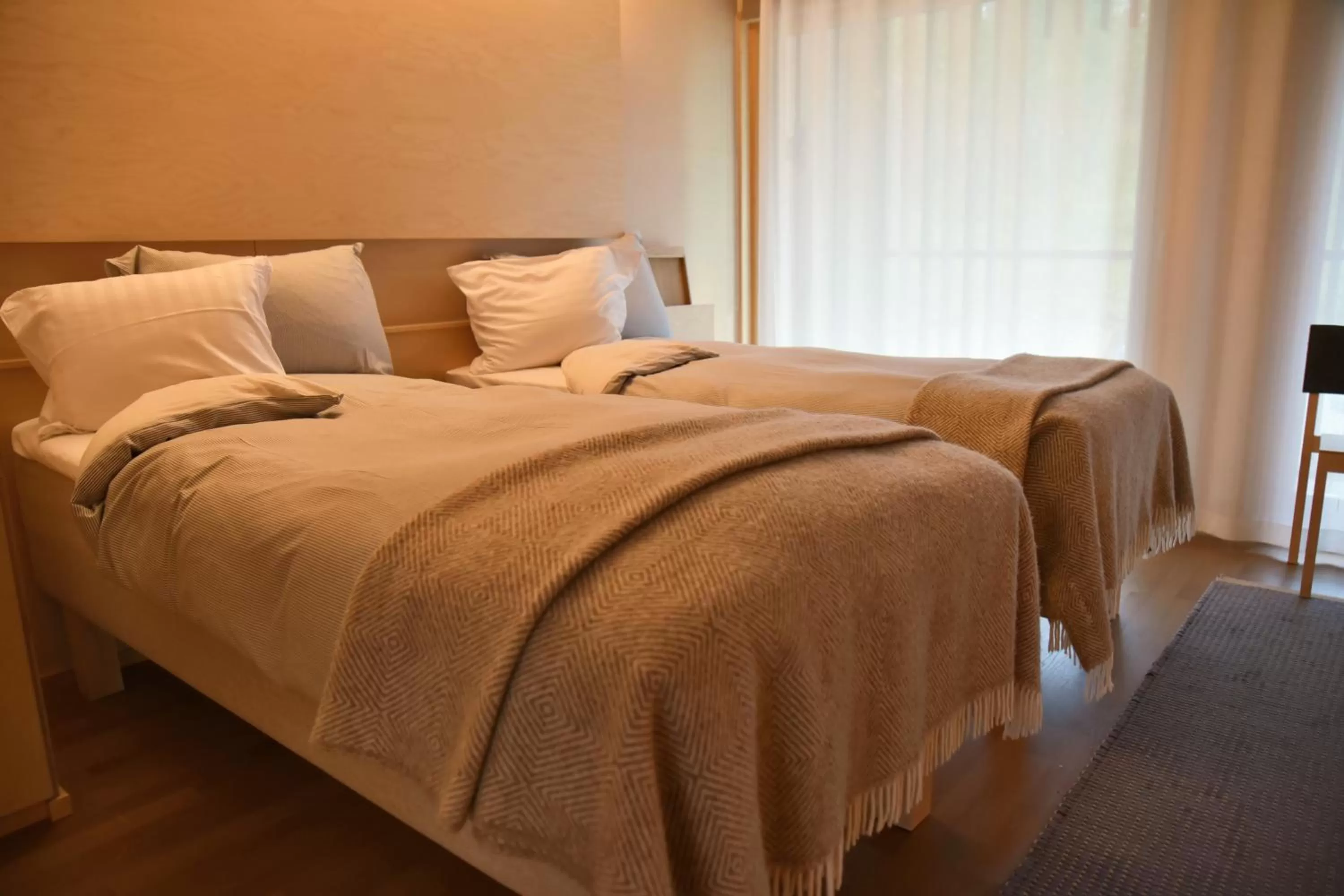 Bed in Saimaanranta Resort by Anttolanhovi