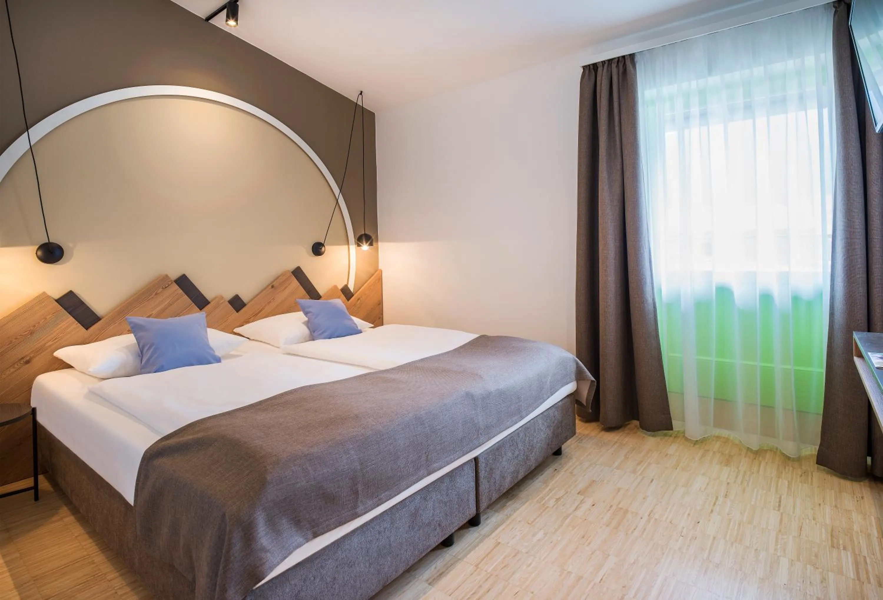 Photo of the whole room, Bed in JUFA Hotel Wipptal