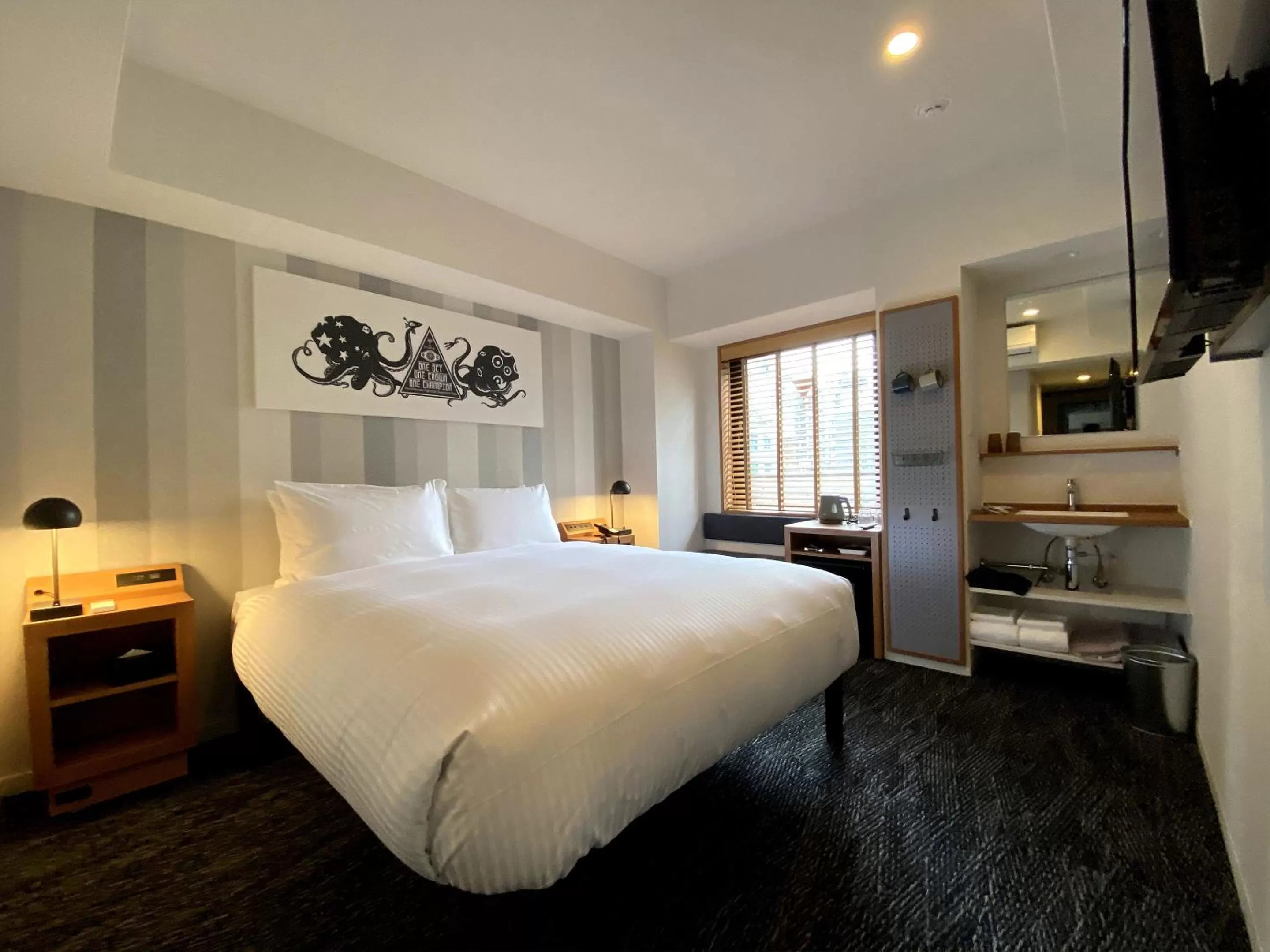 Bed in UMEDAHOLIC HOTEL