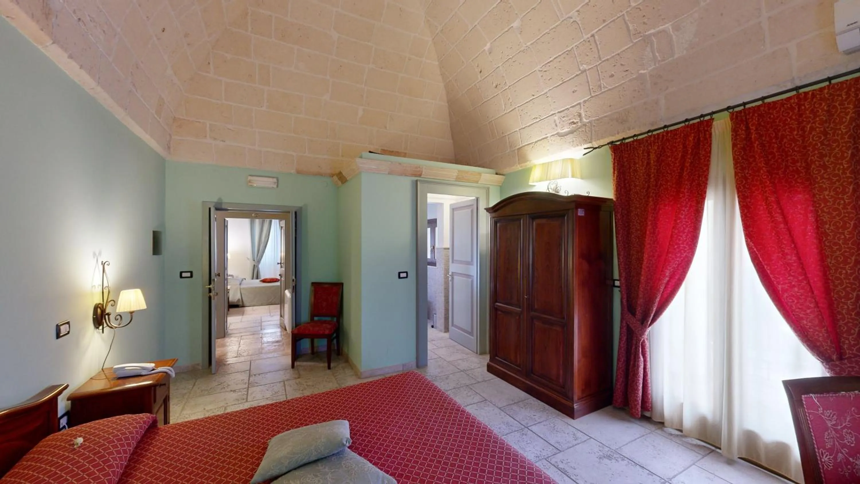 Bed in Relais Reggia Domizia