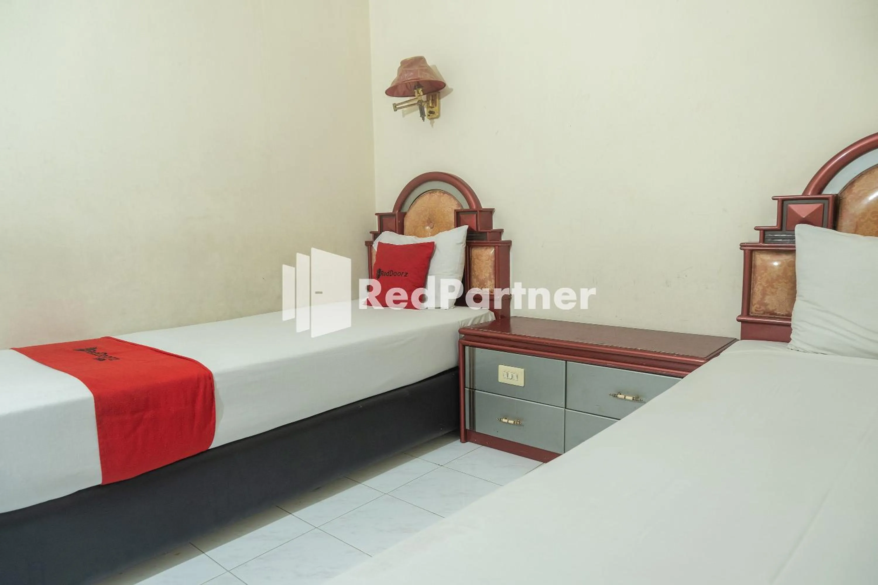 Bed in Akur Hotel Malioboro Mitra RedDoorz