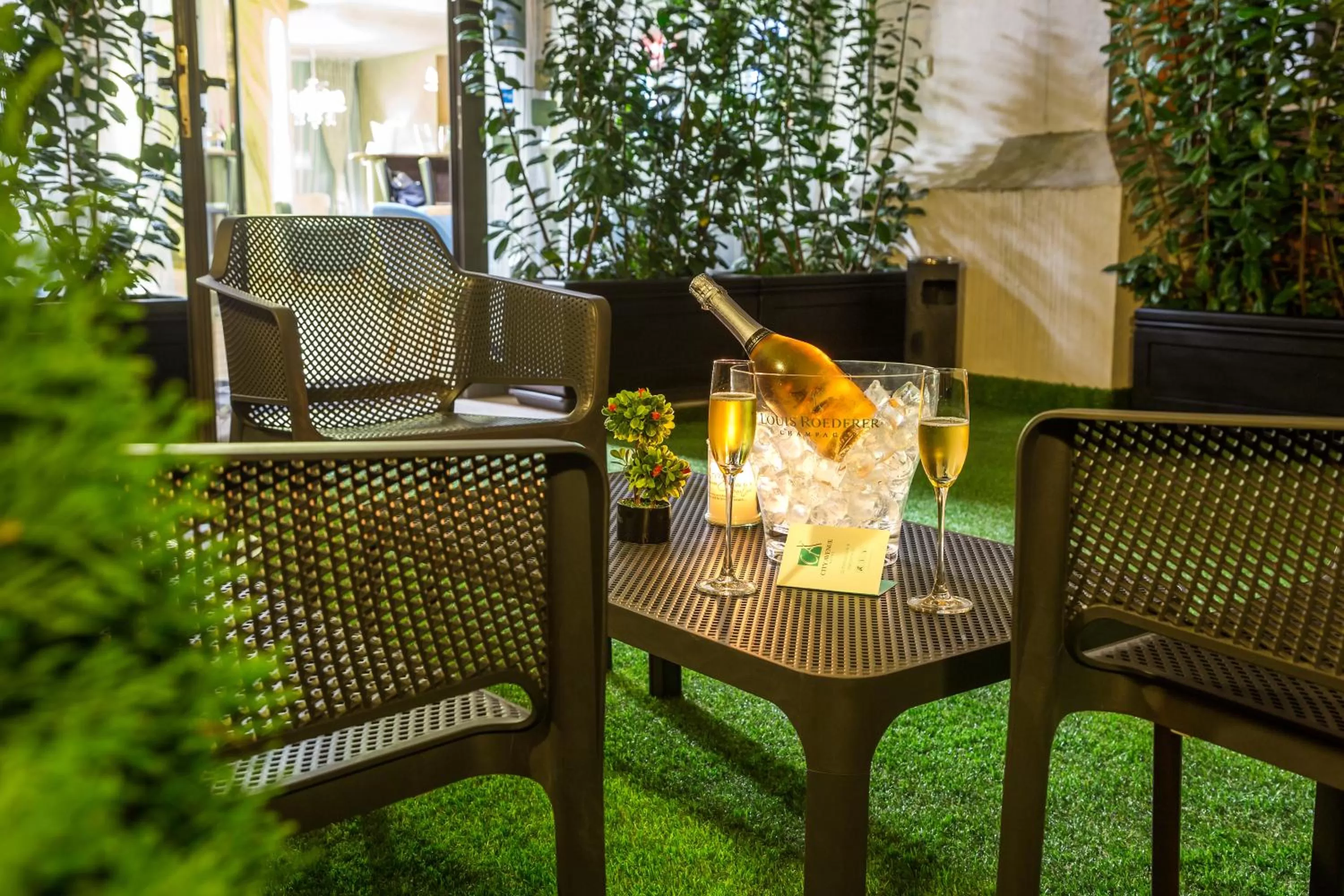 Patio in City Avenue Hotel by HMG-Free Parking-Free Wi-Fi
