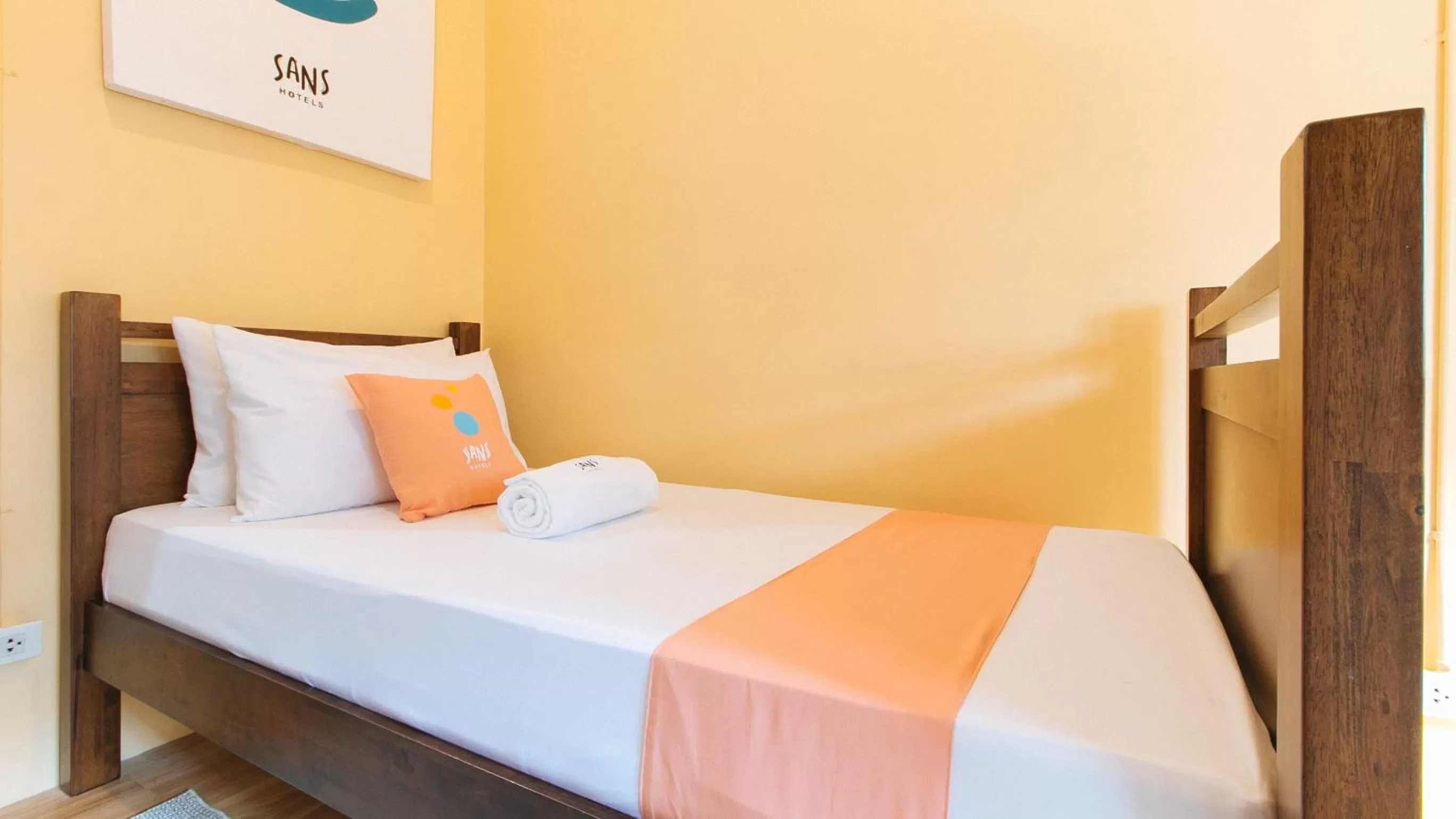 Bed in Sans Hotel Laperal Manila