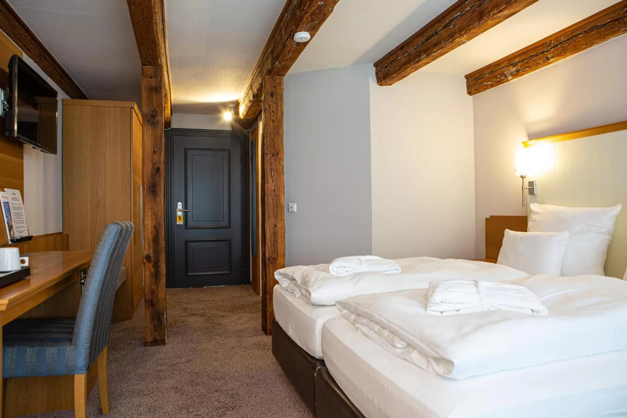 Bed in Romantik Hotel Aquarium