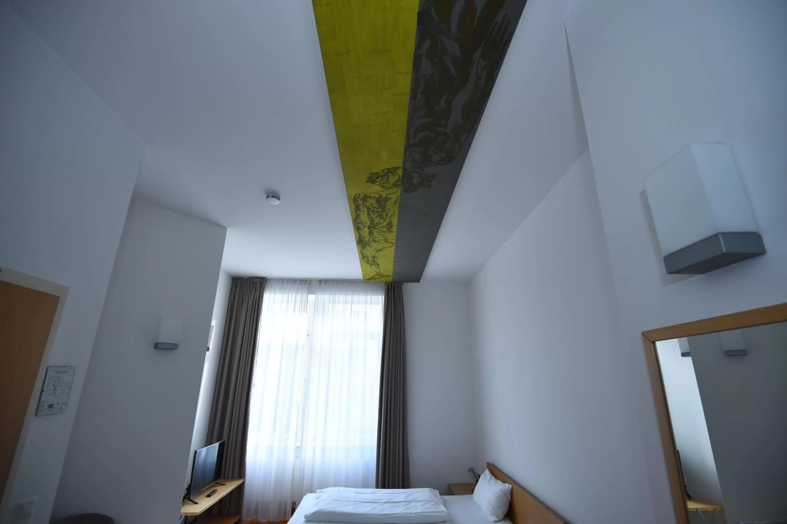 Bed in Art-Hotel Robert Mayer