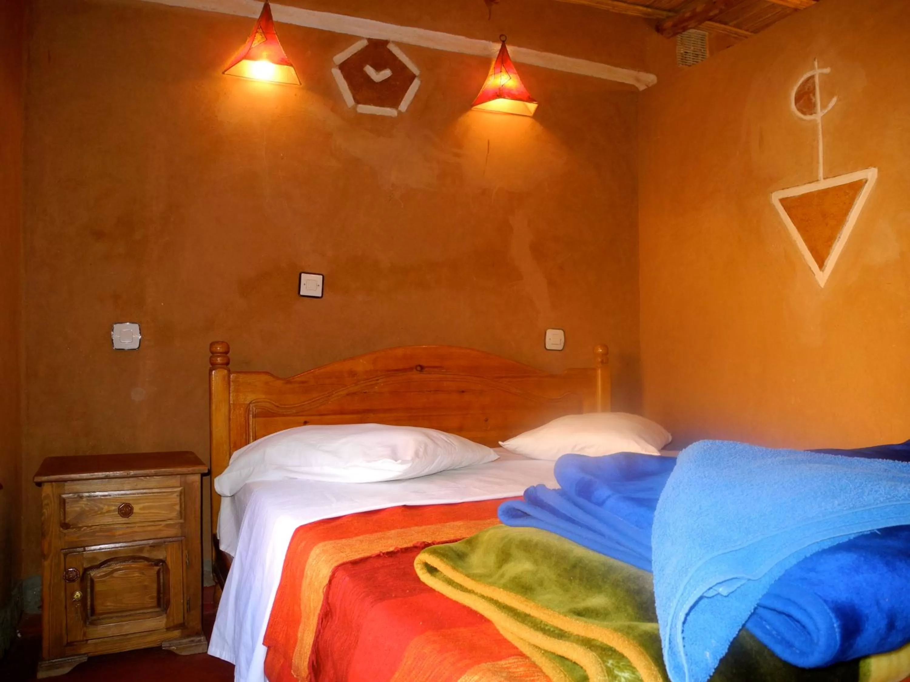 Bed in Maison d'Hôte Valentine