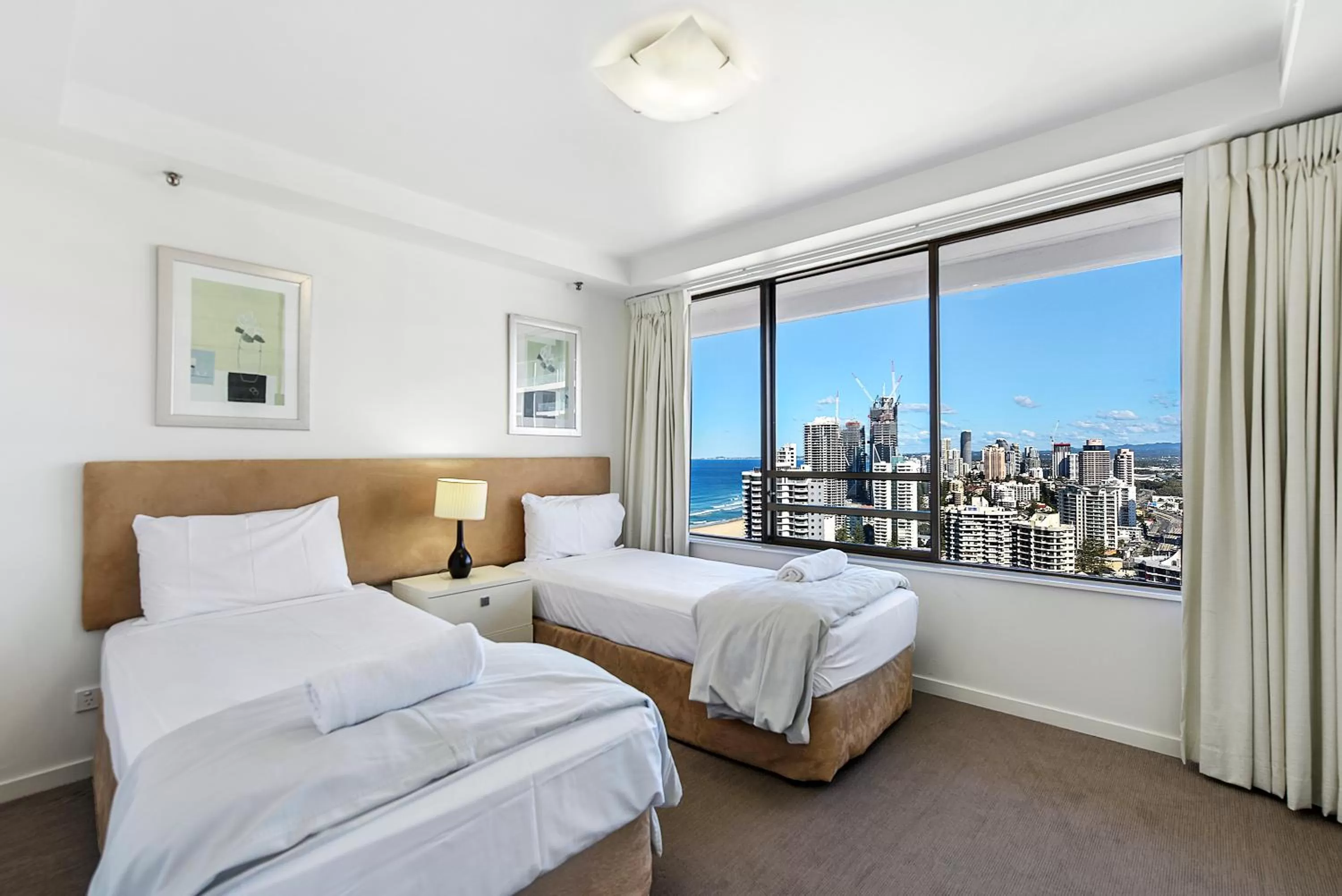 Bedroom, Bed in Surfers Century Oceanside Apartments