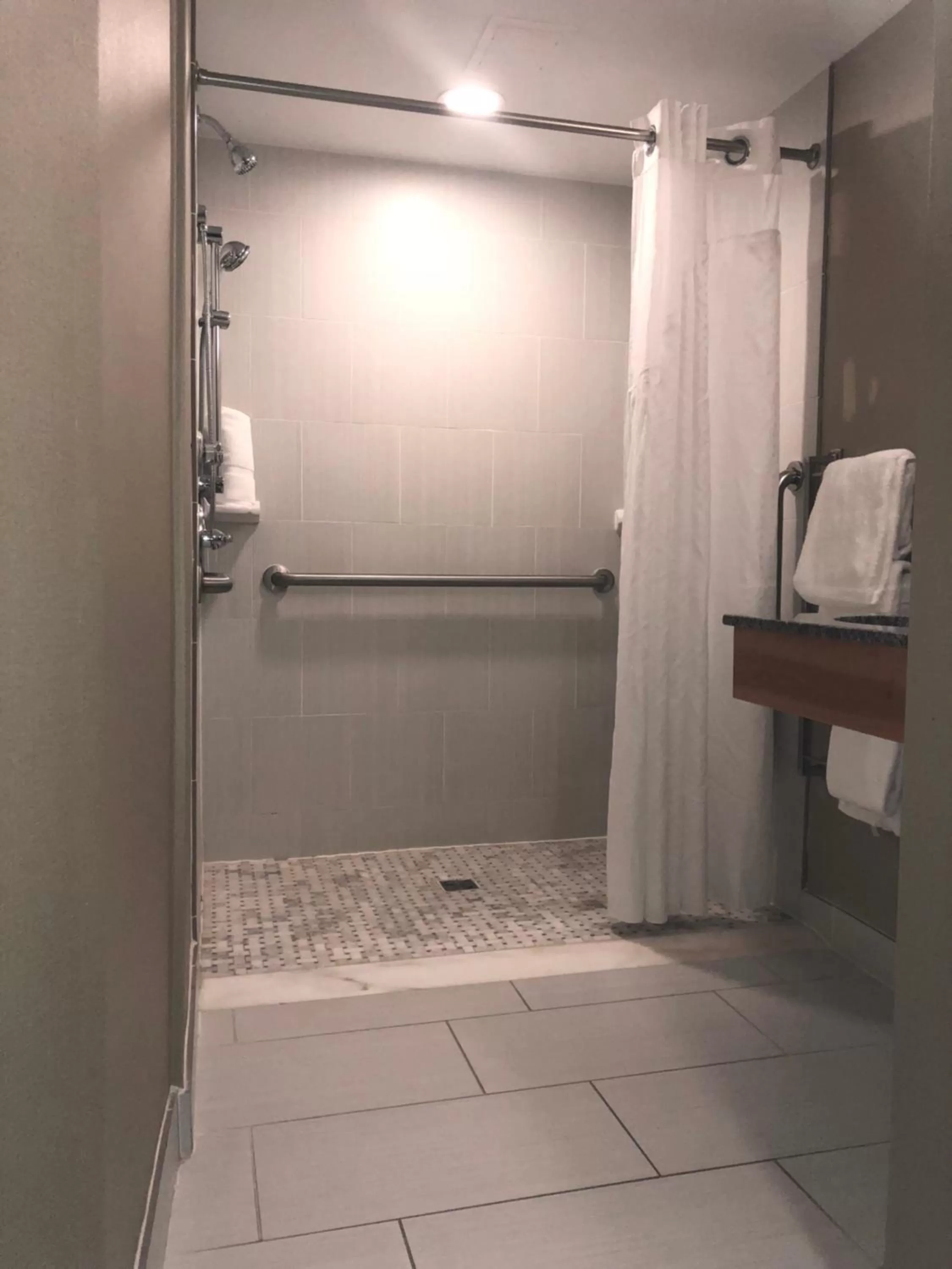 Shower in Holiday Inn Raleigh Downtown by IHG