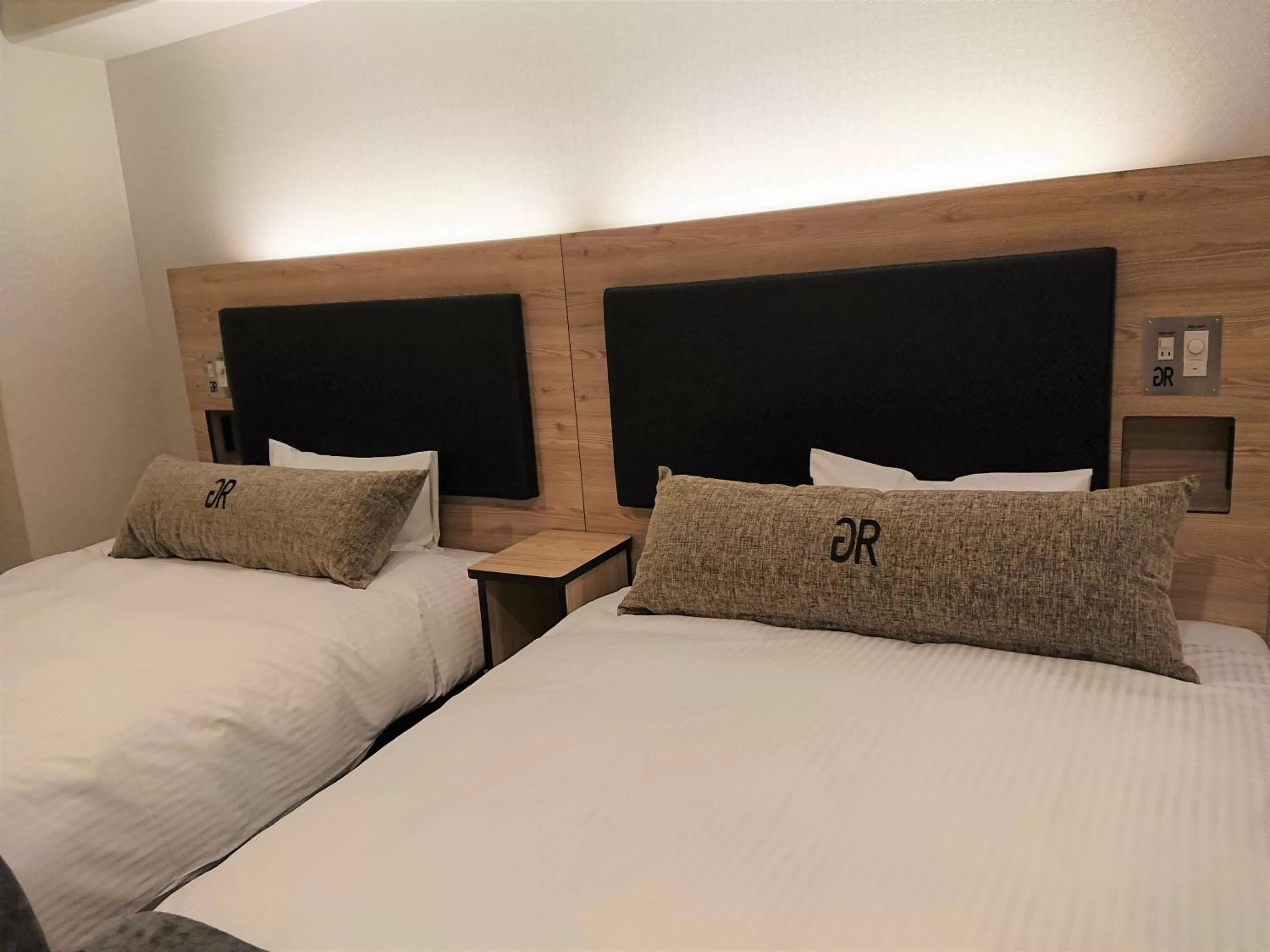 Bed in Green Rich Hotel Kurume Natural Hot Spring Arimamutsumonnoyu