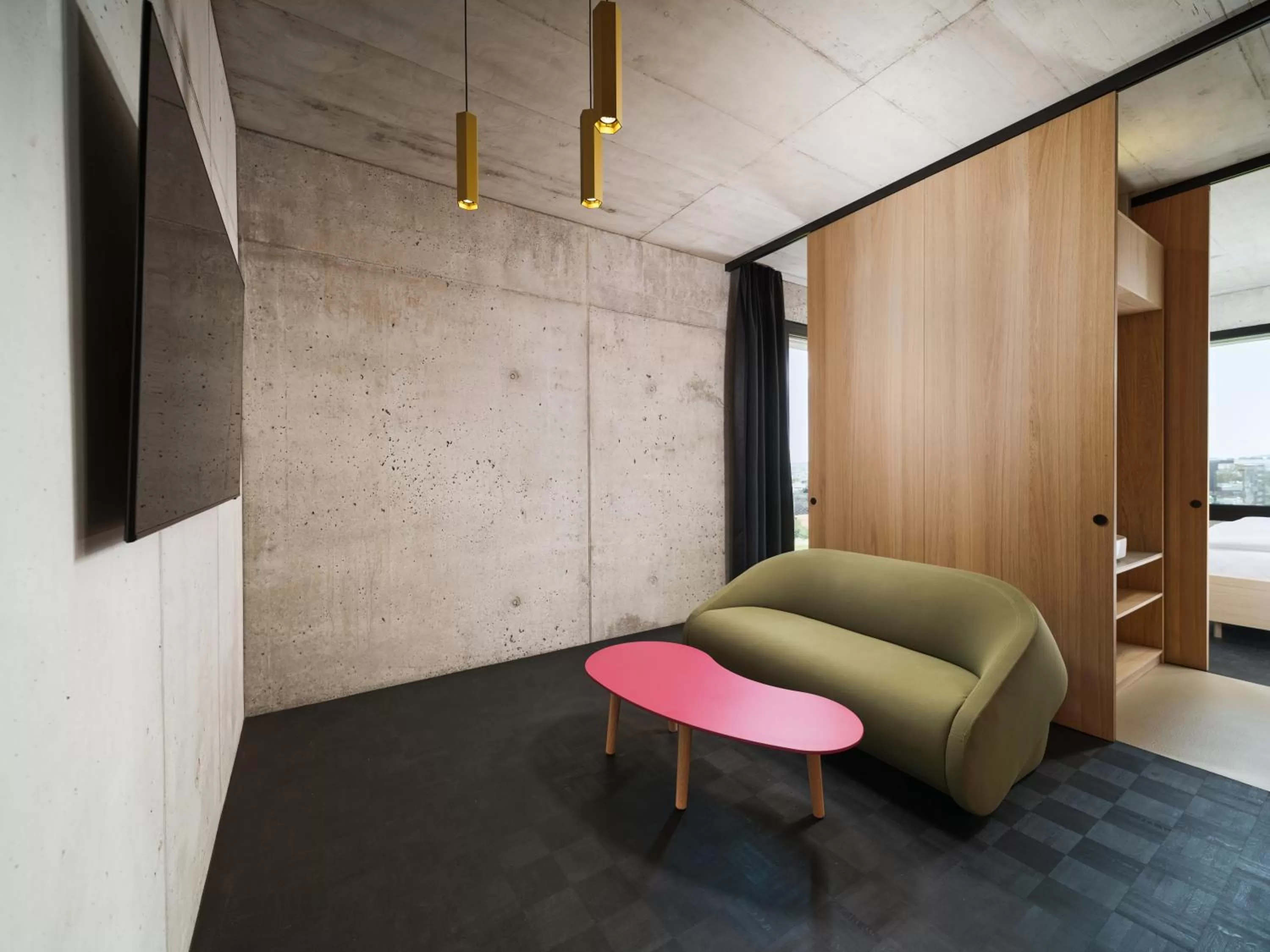 Living room, Bed in Boulderbar Hotel Self-Check in