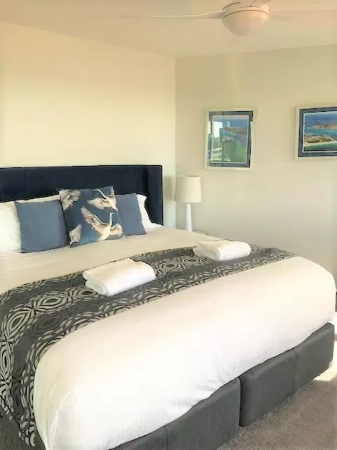 Bed in Sunrise Luxury Apartments