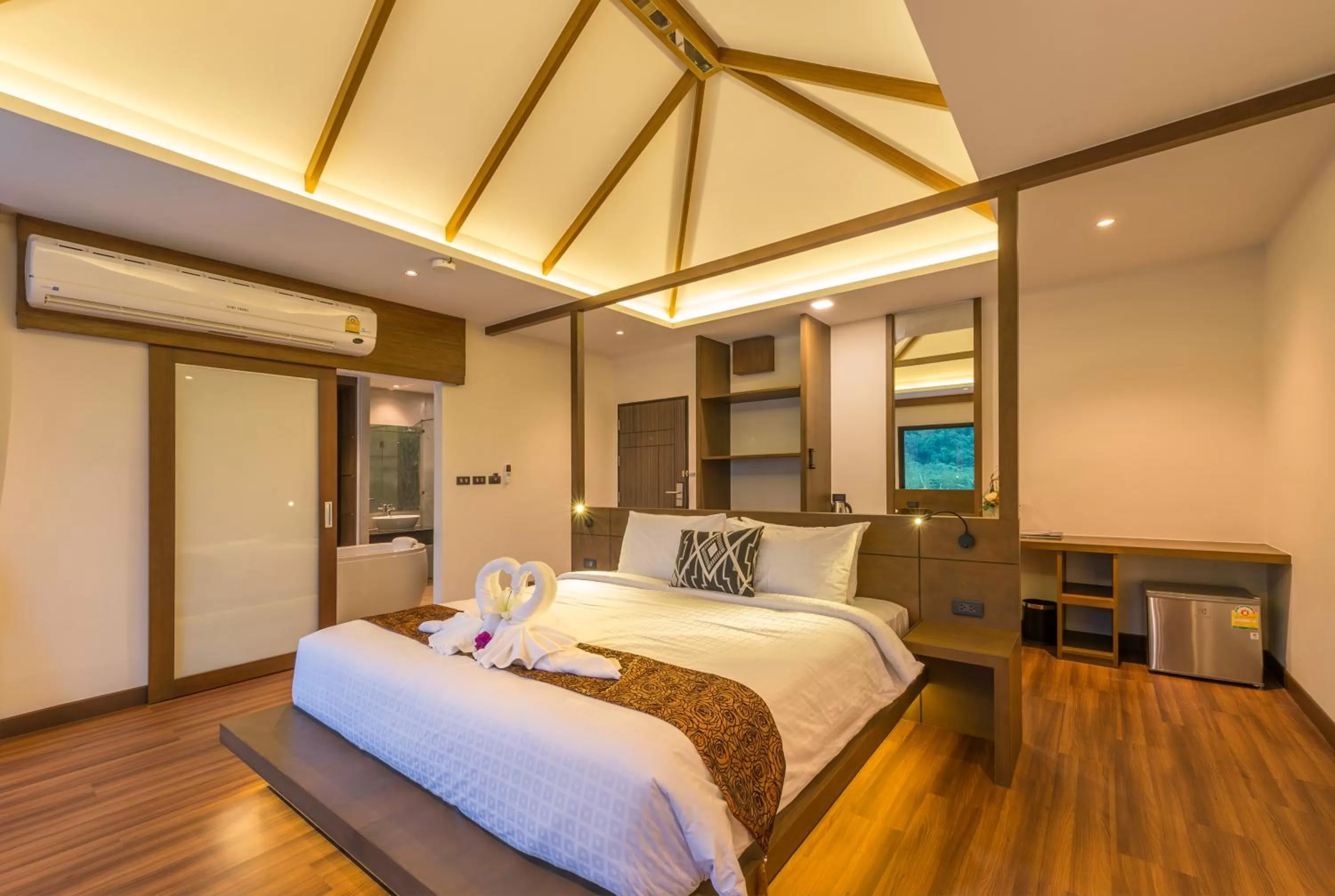 Bed in Cher​mantra​ Aonang​ Resort & Pool​ Suite