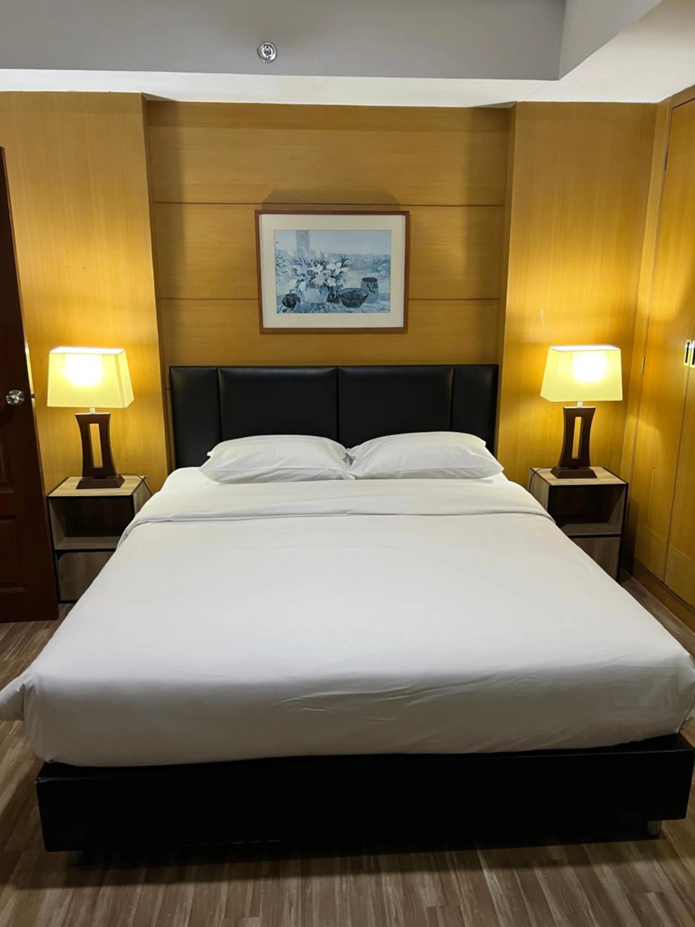 Bed in Mall Suites Hotel