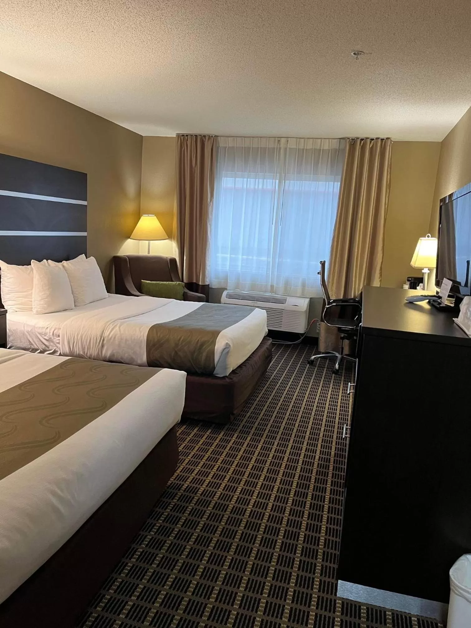 Bed in Quality Inn & Suites