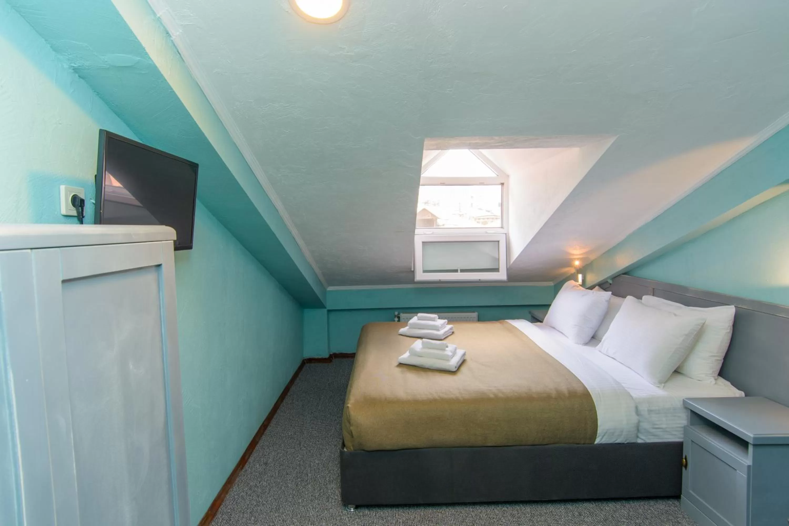 Bed in Kindli Boutique Hotel