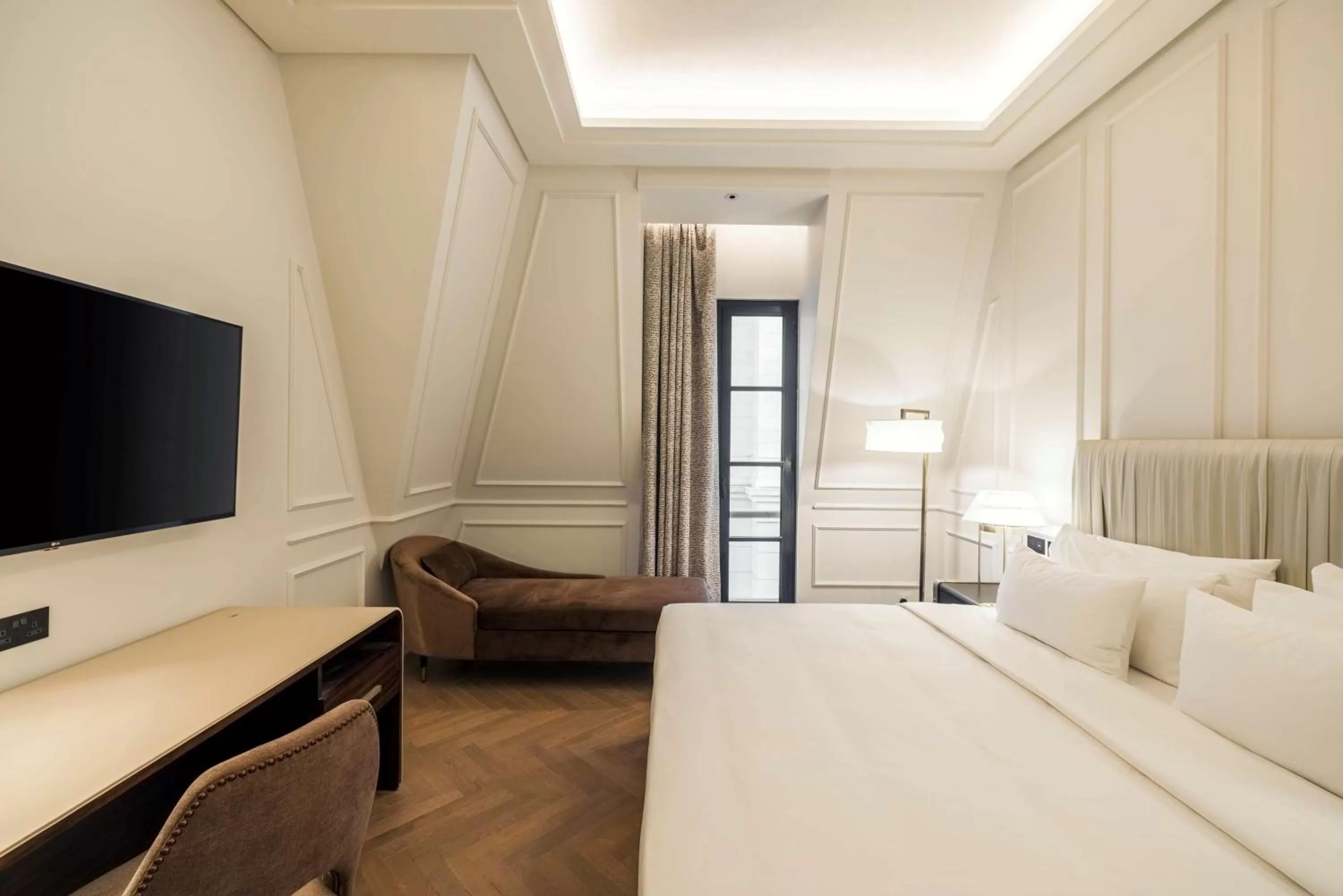 Photo of the whole room, Bed in Mansard Riyadh, a Radisson Collection Hotel