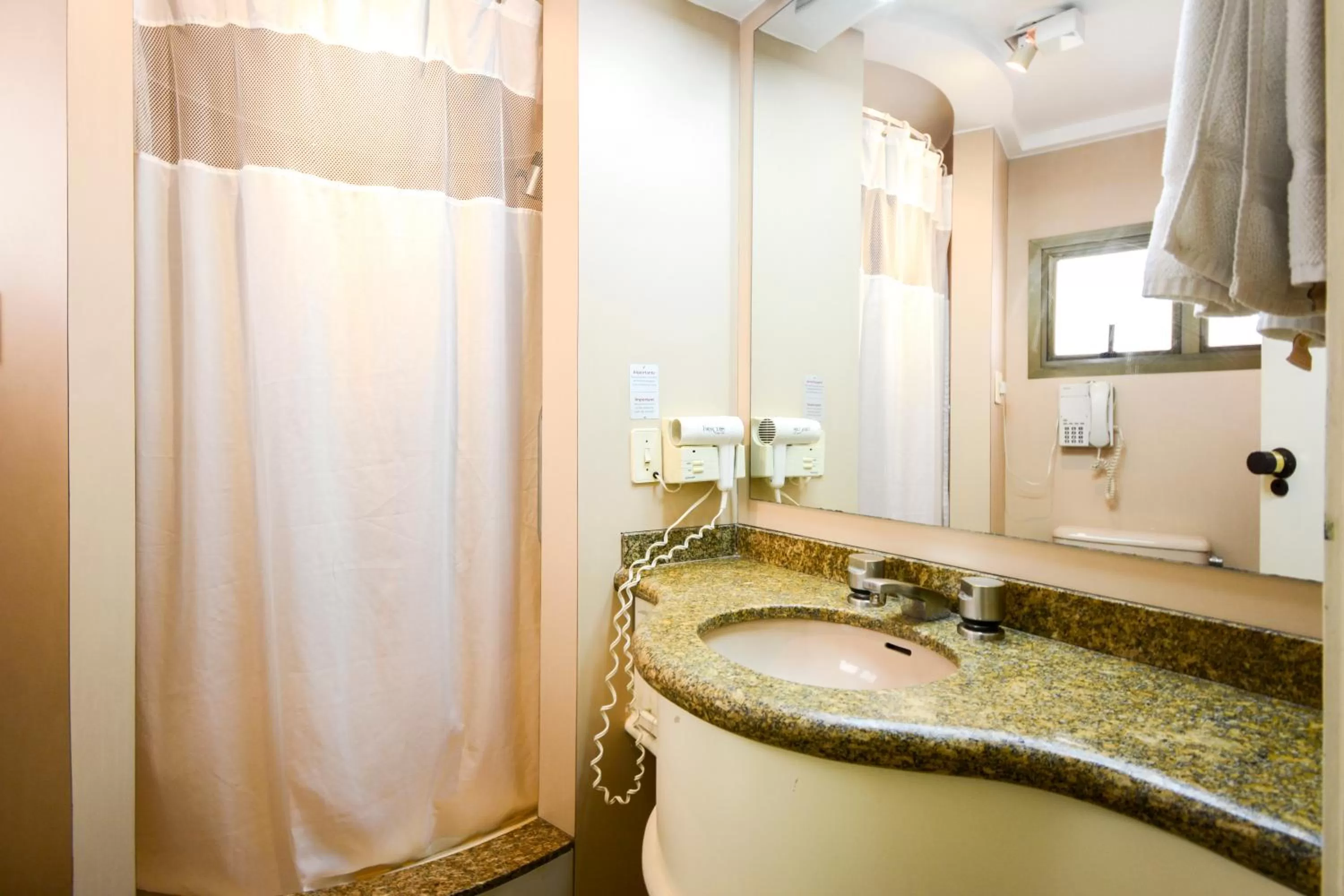 Bathroom in Wall Street Apartments by BnbHost