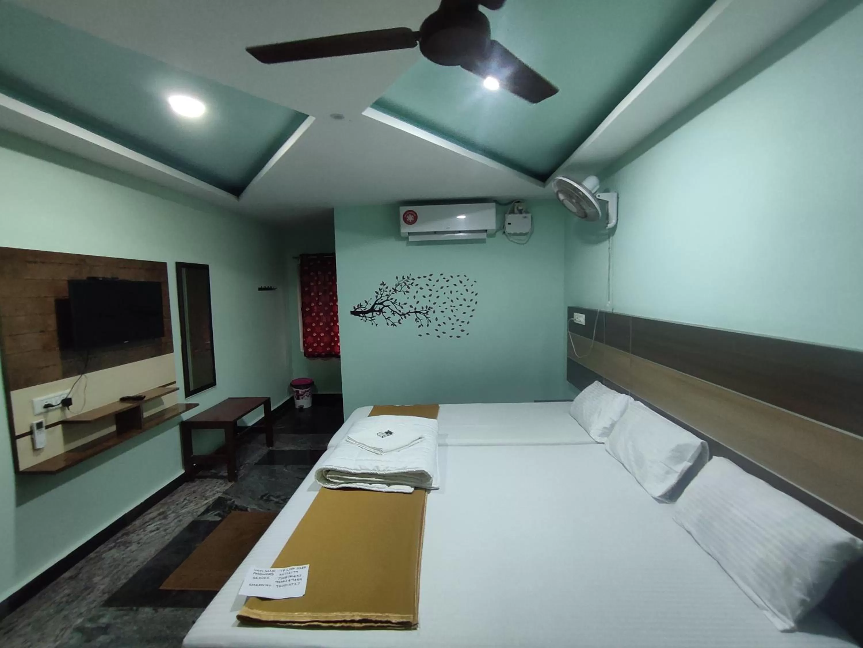 air conditioner, Bed in Sri Murugan Beach Paradise Hotel