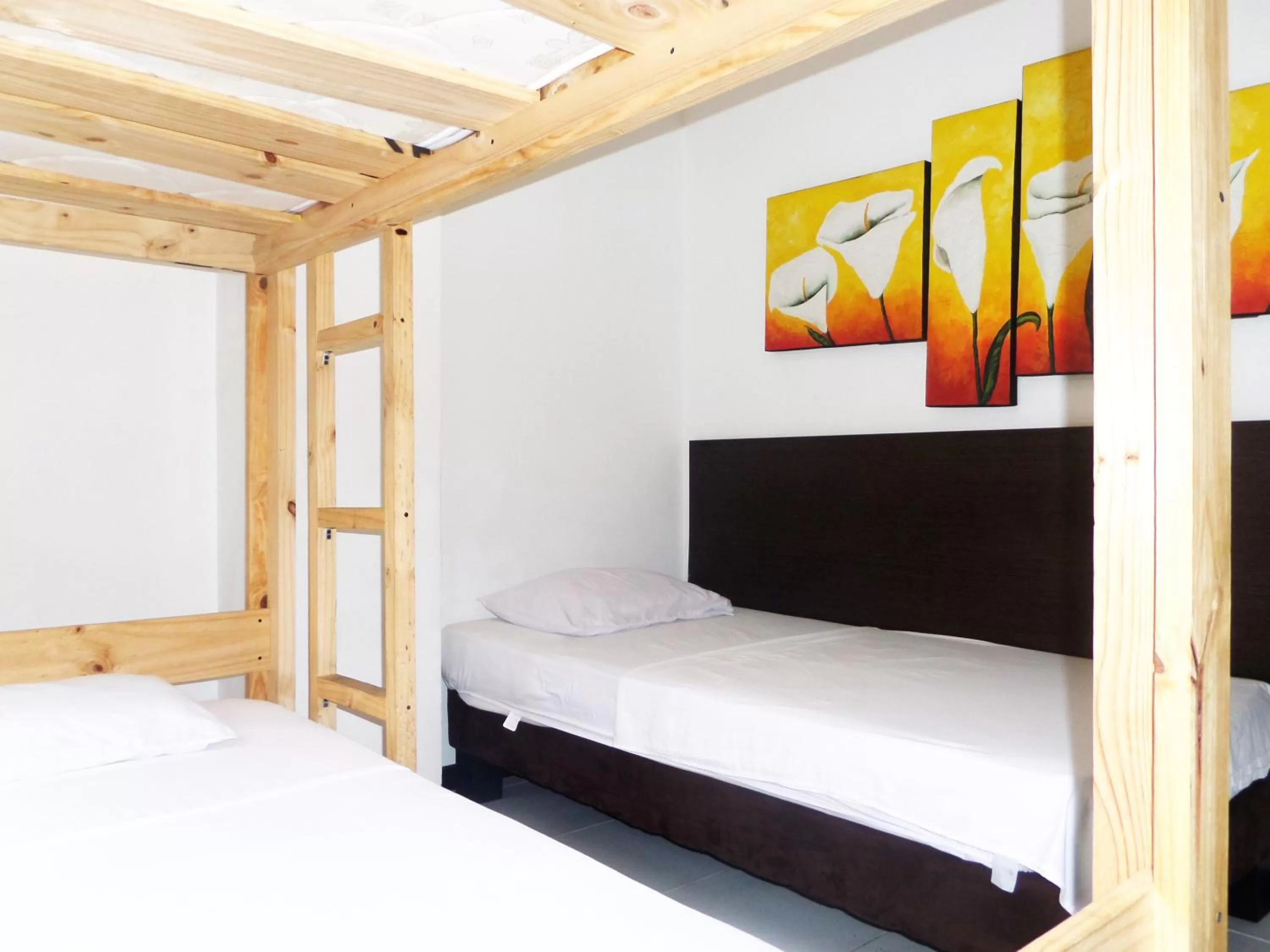 Bed in Apartasuites San Marcos