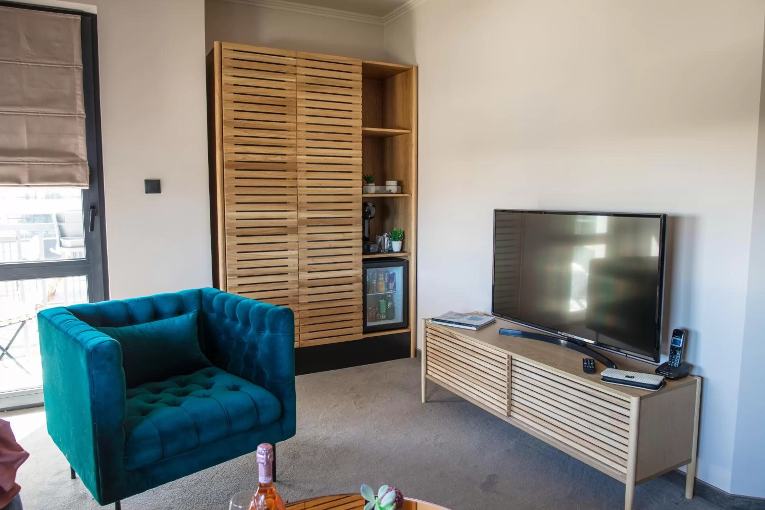 Communal lounge/ TV room in Reverence Boutique Hotel