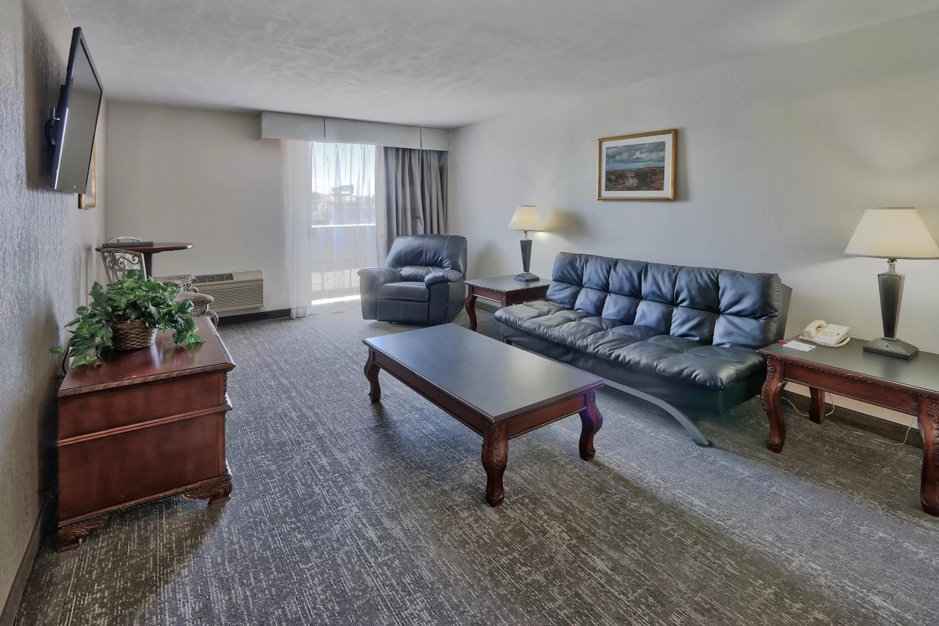 Living room in Ramada by Wyndham Albuquerque Midtown