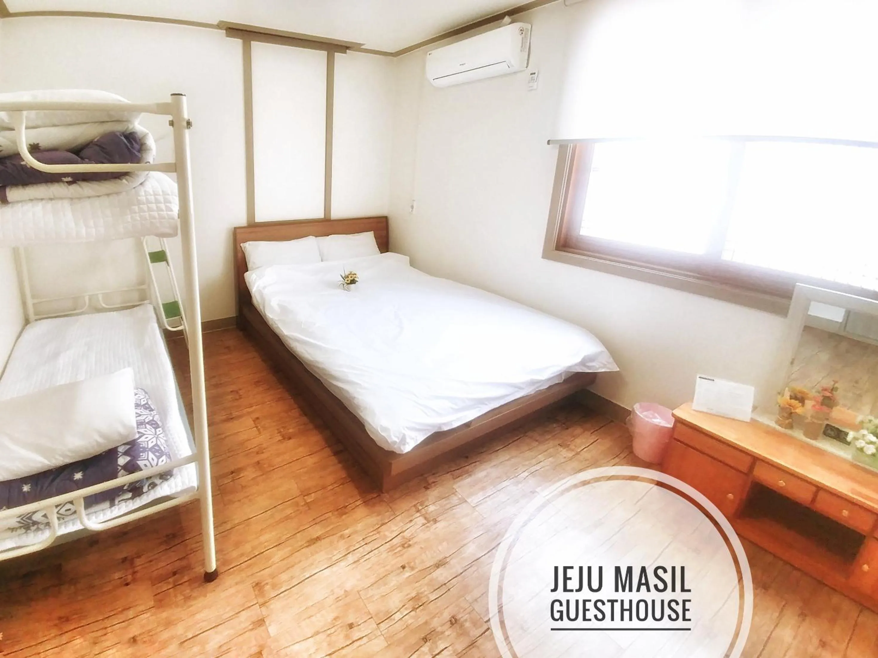 Bed in Jeju Masil Guesthouse