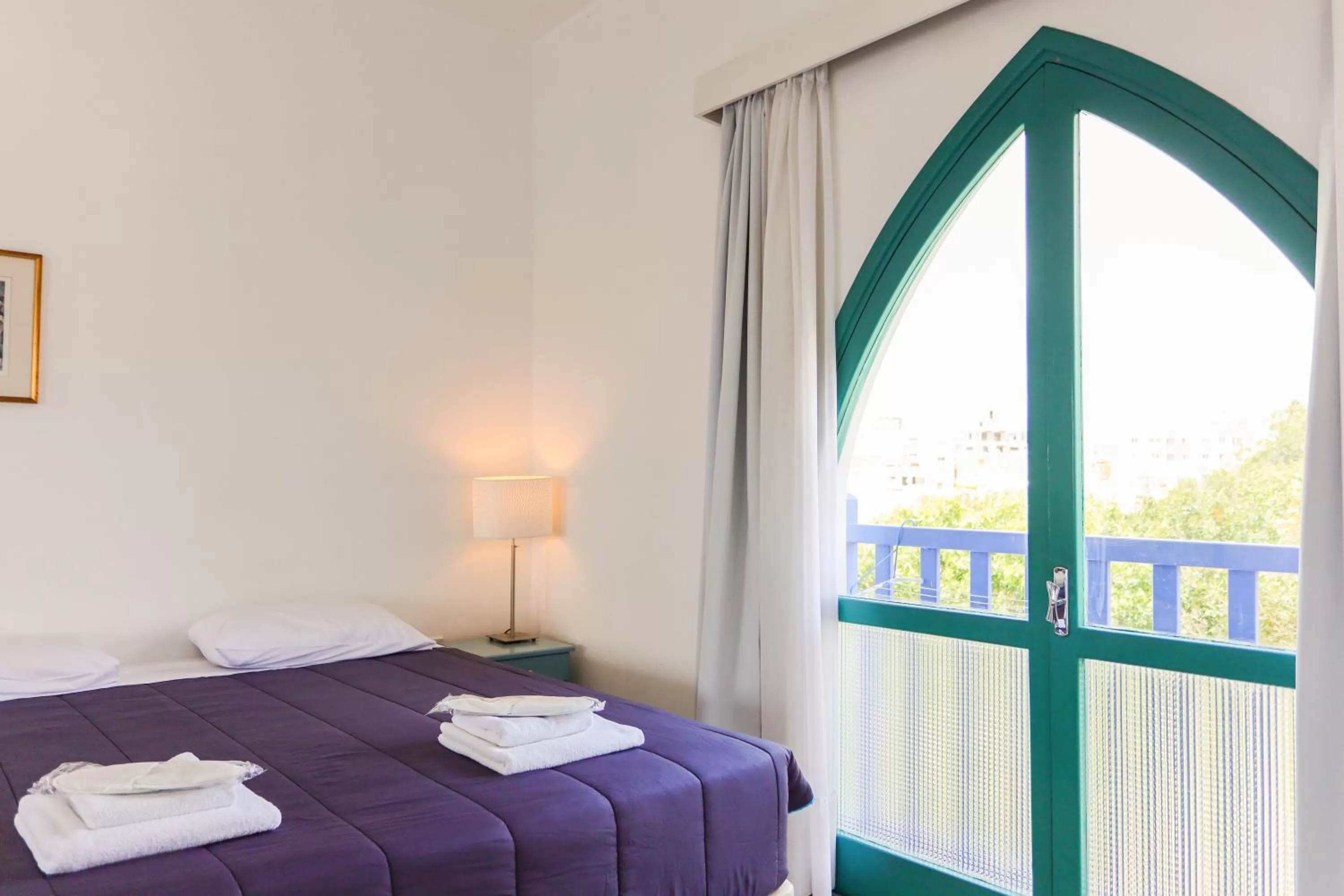 Bed in Axiothea Hotel