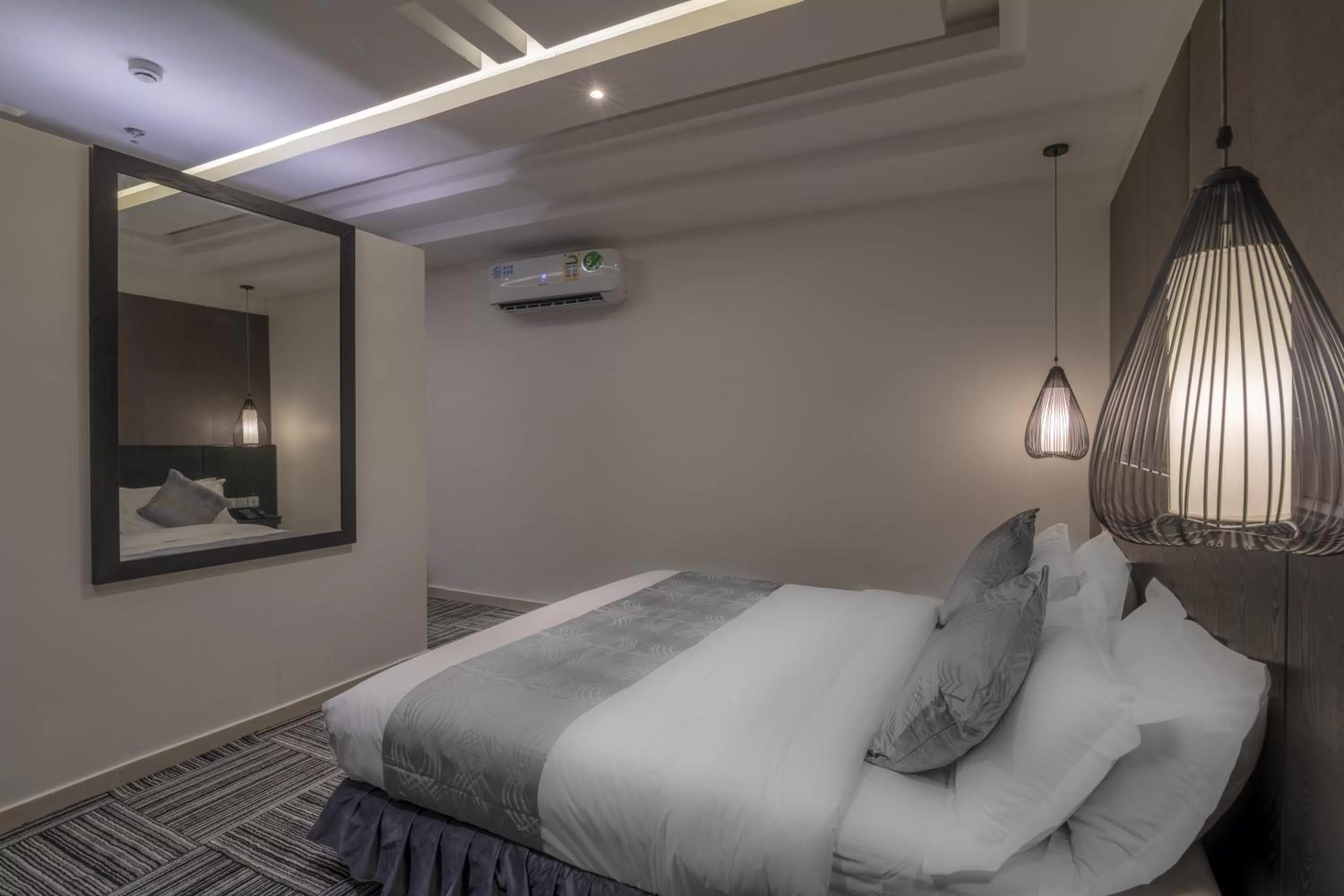 Bed in South Hotel Suites