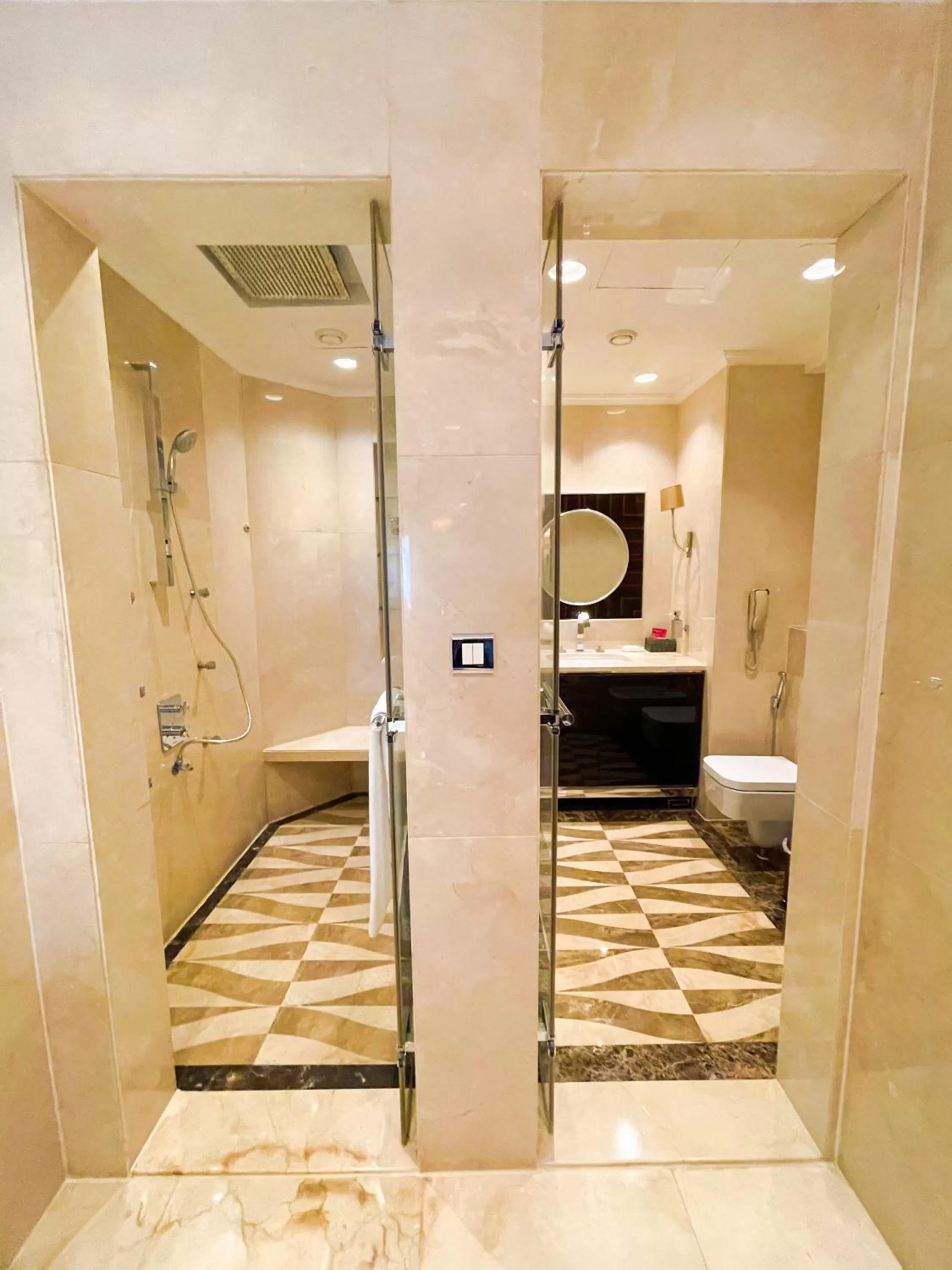 Bathroom, Bed in Mövenpick Grand Al Bustan