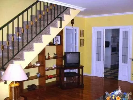 Communal lounge/ TV room in La Casona del Abuelo Parra