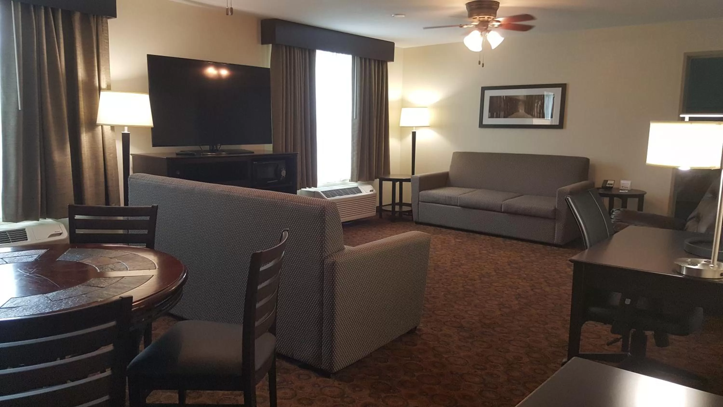 Living room in AmericInn & Suites Burnsville, MN