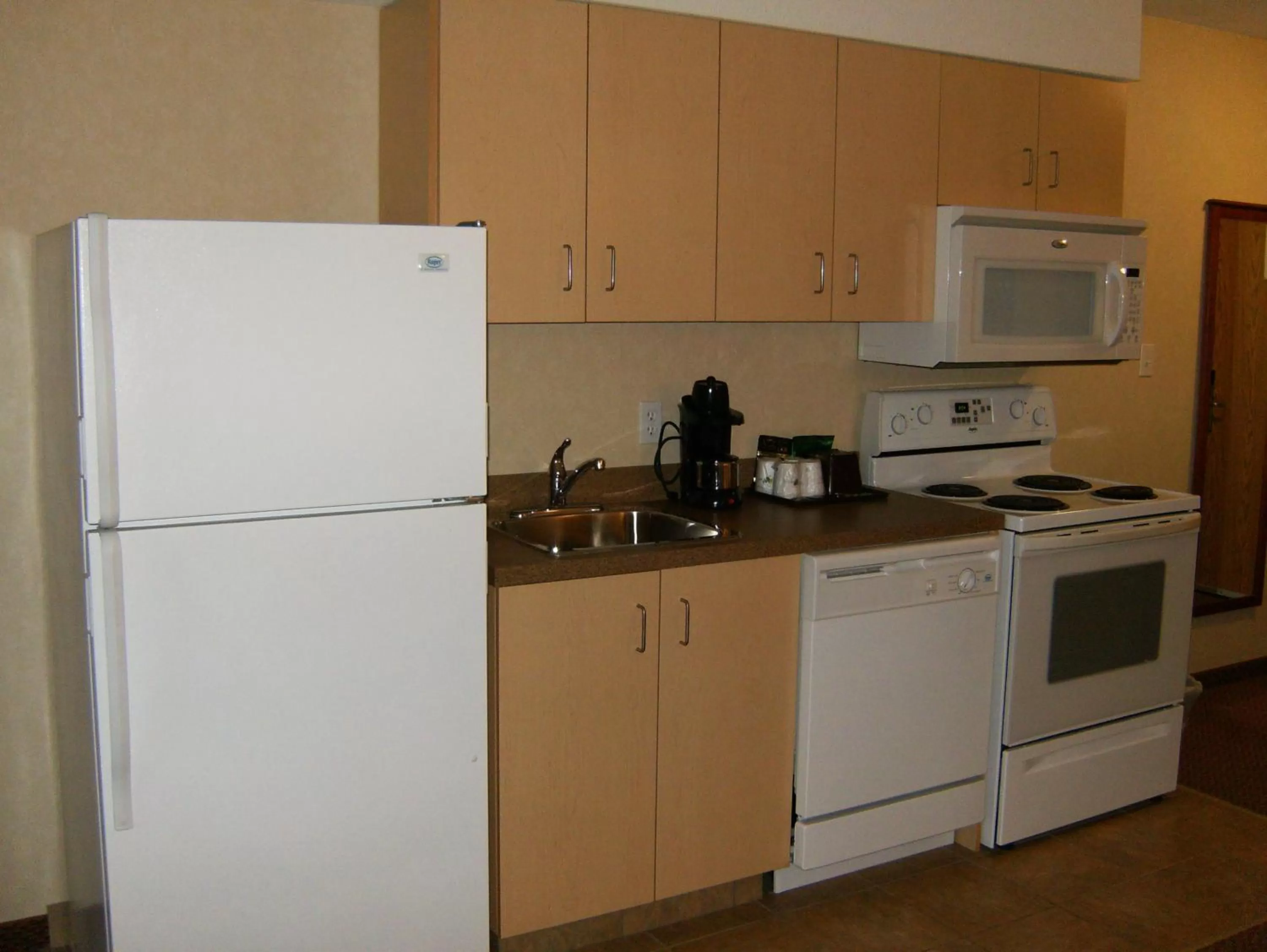Kitchen or kitchenette in Super 8 by Wyndham Grande Prairie