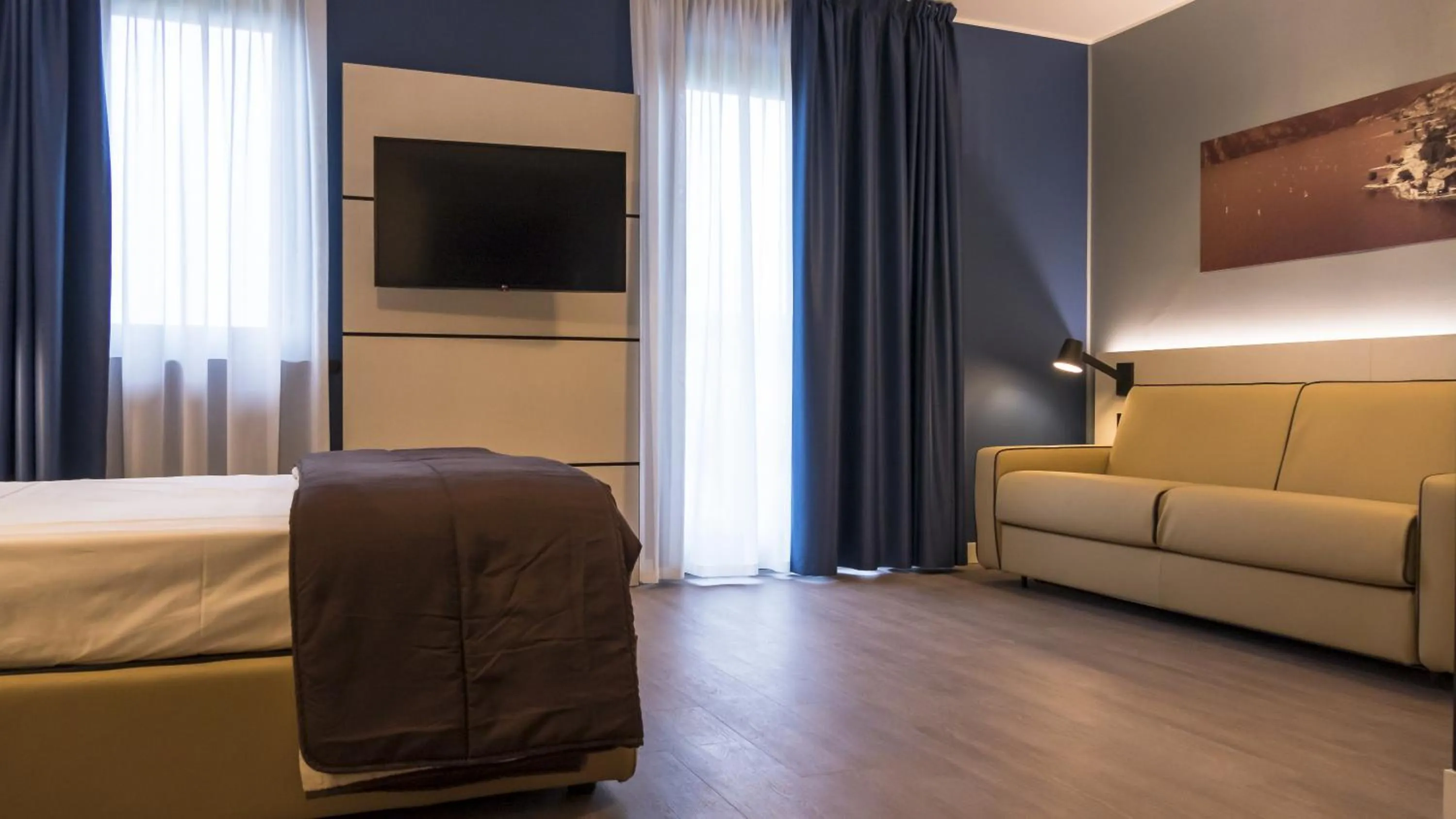 Bed in Hotel Puccini