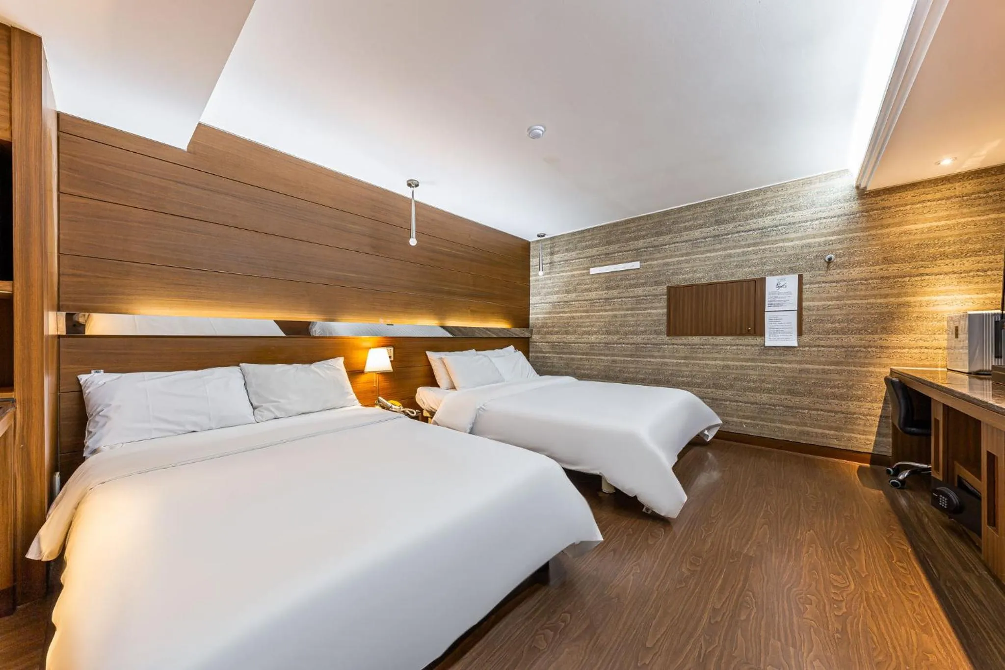 Bed in Friendly DH Naissance Hotel by Mindrum Group