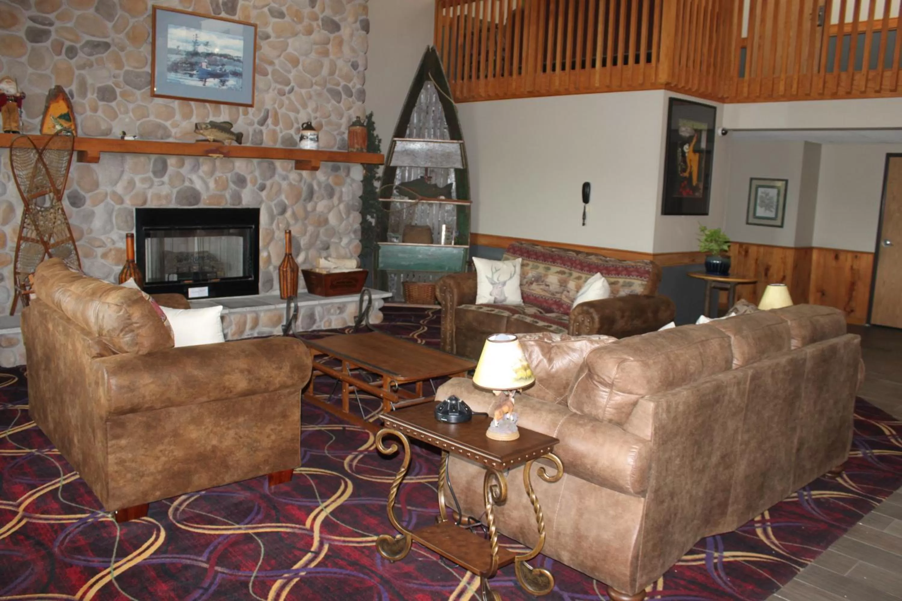 Seating area in AmericInn by Wyndham West Burlington