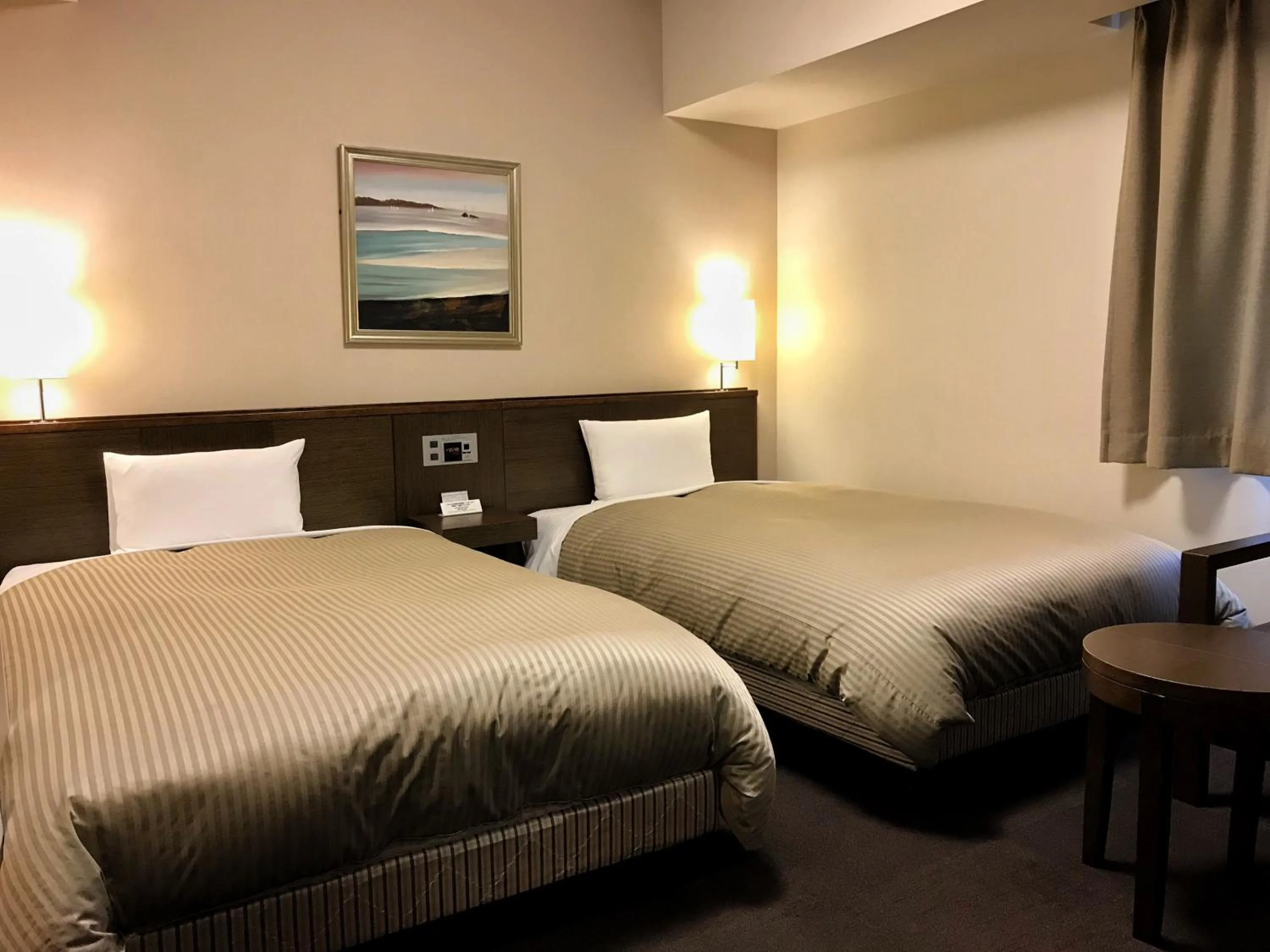 Photo of the whole room, Bed in Hotel Route-Inn Sapporo Chuo