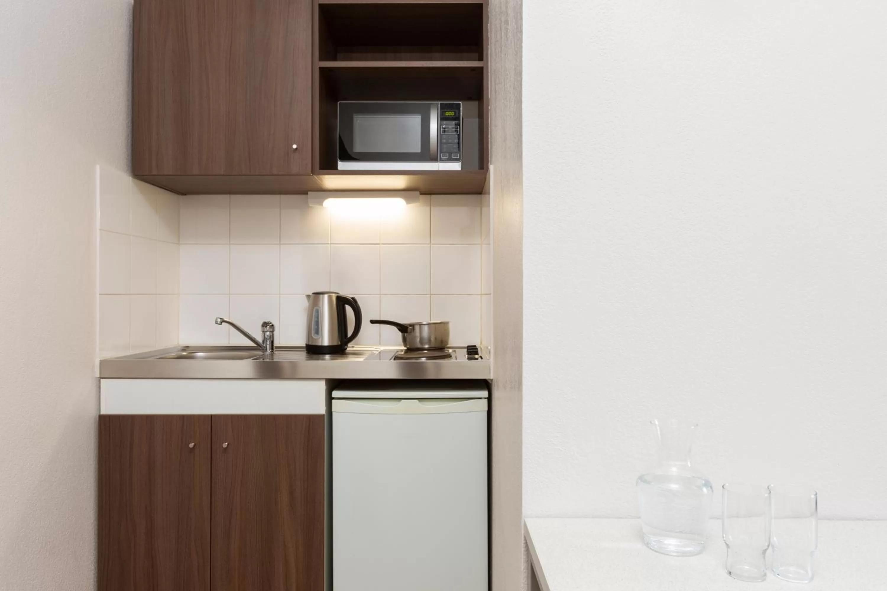 Kitchen or kitchenette in Aparthotel Adagio Access Carrières Sous Poissy