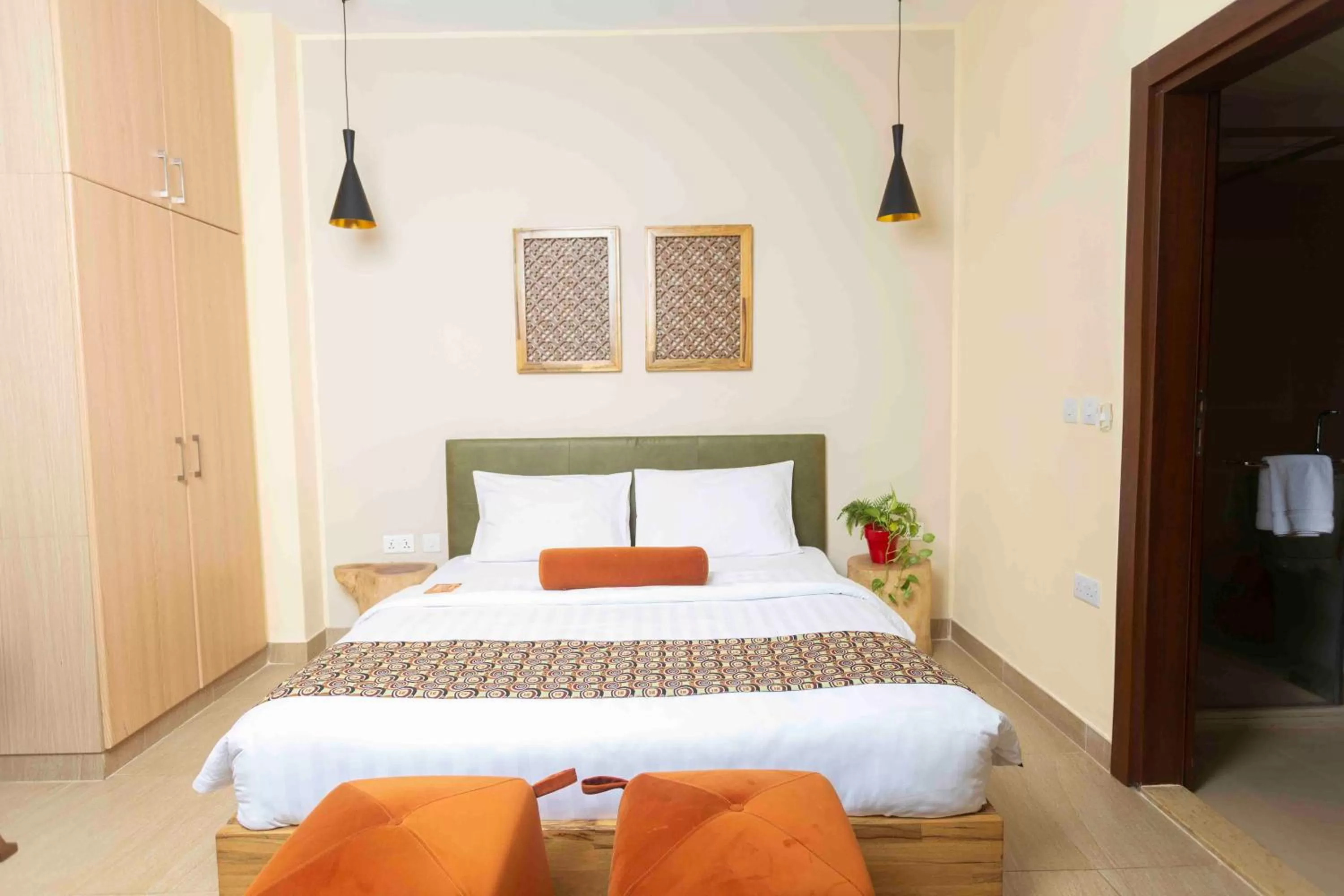 Bed in Roots Hotel Apartment